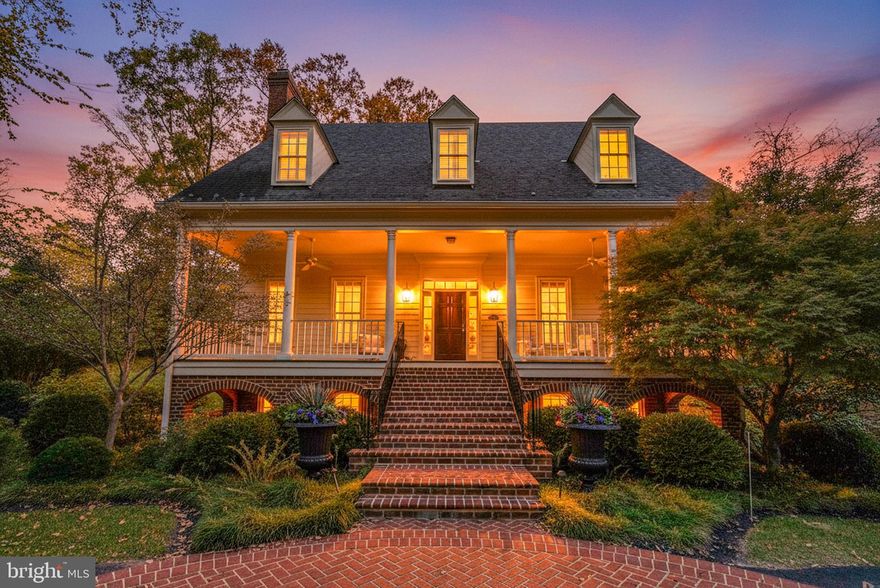 Timeless Colonial Charm Meets Modern Luxury in a Private, Parklike Setting! - Tucked quietly off the main road in Alexandria’s sought-after Jefferson Park neighborhood, this stunning five-bedroom, four-and-a-half-bath Colonial offers the perfect blend of elegance, comfort, and convenience. Set back in a peaceful enclave surrounded by mature trees and lush gardens, the home feels worlds away—yet Washington, DC, Old Town, and all of Alexandria’s favorite amenities are just minutes from your door. *Beautifully constructed and thoughtfully renovated between 2012–2014 (with over $500,000 in enhancements), the home was designed for modern living while honoring classic craftsmanship. The welcoming front porch and manicured landscaping lead inside to generous, light-filled rooms with high ceilings and refined finishes throughout. *The main level is an entertainer’s dream, featuring a gracious living room with a gas fireplace, a formal dining room, a cozy family room, and an inviting office. The gourmet kitchen—renovated to perfection—boasts premium appliances such as Wolf (8-burner gas range and microwave) and SubZero (freezer and refrigerator), custom cabinetry, granite countertops, a deep farmhouse sink, a large center island ideal for cooking and conversation, built-in banquette seating, and a dedicated full-size wine refrigerator (SubZero) for your favorite vintages. A butler’s pantry connects the kitchen to the dining area, offering additional storage, prep space, and a convenient serving area. A charming breakfast nook captures soft morning light and garden views, creating the perfect spot to read, snack, or enjoy coffee. French doors open from the kitchen to the home’s expansive backyard retreat, seamlessly blending indoor and outdoor living. *Out back, the professionally landscaped garden feels like a private resort. A wood-burning outdoor fireplace anchors the stone patio, while a custom putting green provides a truly unique feature for recreation and relaxation alike—ideal for quiet afternoons or entertaining guests. Surrounded by mature greenery and enhanced with an irrigation system, the outdoor spaces are as functional as they are beautiful. *Upstairs, you’ll find four spacious bedrooms and three full baths, including a tranquil primary suite with a gas fireplace and a well-appointed ensuite bath. The finished lower level offers flexible living space—currently used as a home gym—with a full bath and abundant additional storage options. *Additional features include a two-car attached garage, a large parking pad accommodating up to three more vehicles (five total), and ample storage under the front porch—perfect for outdoor gear or simply relaxing with a good book, even when the weather isn’t ideal. *Ideally located within walking distance of local schools—George Mason Elementary, Alexandria Country Day, and St. Stephen’s and St. Agnes—this home offers exceptional convenience and accessibility. With neighborhood parks nearby and the vibrant shops and dining of Del Ray and Old Town just moments away, it delivers the best of both worlds: a private, tucked-away retreat with effortless access to everything Alexandria has to offer. *To avoid a traffic jam in the driveway during the open house, PLEASE park on the street of Woodland Terrace and walk up the driveway to the property. THANK YOU!