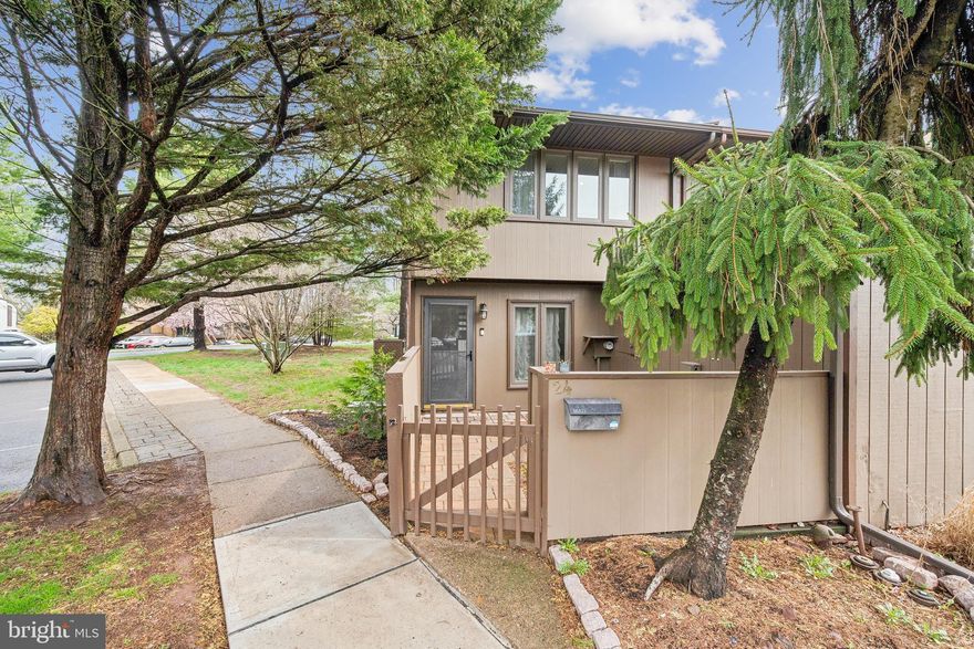 Exceptional end unit townhome in Village 2, clean, crisp, updated, freshly painted, carpeted and ready for new owners!  The location can't be beat, close to the park-like circle, tennis courts and pools, with plenty of parking right out front.  A front courtyard invites you in with small garden and pavers, as well as an ample outdoor storage shed.  Enter into the eat-in kitchen with NO STEP DOWN (as some units have), with updated cabinets, appliances and granite countertops.  The main floor has neutral laminate floors, 1/2 bath, and plenty of storage including under the stairs.  Upstairs has fresh carpet, laundry, full bath and two bedrooms.  Overall, this home is bright, has newer windows and roof, surrounded by trees and a quiet setting.  Enjoy the back patio and bucolic setting, as well as all the amenities that Village 2 has to offer!