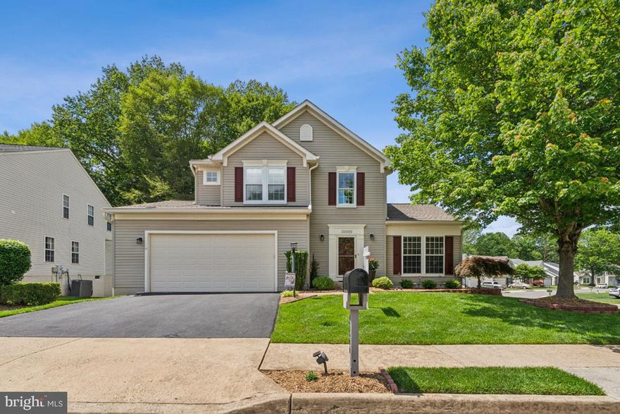 PRICE REDUCED!!! Welcome to 15600 Catrock Sluice Way, which is placed in one of the most well known and sought out neighborhoods, the desirable Ashland community. This beautiful and magnificent colonial home with 4 bedrooms and 3.5 bathrooms, placed on .15 acres comes as quite the exceptional property due to it's especially unparalleled care and attention that it's received from the original owners. Upon first glance you'll notice the delightful landscaping designs which gives this home it's outdoor pleasing aesthetics. Upon entering into the foyer, you're shown the entrance to the spacious living room and dining room that is ideal for hosting guests for your choice of occasion. The gourmet kitchen which was upgraded in 2021 now features granite counter tops with a newer and well sized granite island with custom drawers for organization. It comes with black stainless steel appliances. Enjoy the peaceful view from the kitchen and/or relax on the beautiful trex deck as it backs into a view of the wooded terrain. Newly distressed hardwood flooring on the main level has recently been installed in 2021. Upstairs you'll be quite impressed with the new designs. The entire main bathroom has been upgraded including all new tile flooring and shower, including a new custom glass shower door with custom vanity to host a double sink. New carpeting has been added to the upper level including all the bedrooms and both sets of stairs.  Bedrooms and hallway area have also been freshly painted with matching tones and colors. All new windows have been installed upstairs minus the casement window in the primary bathroom. During the warmer months, the attic fan and attic insulation will help keep the entire upstairs much more moderate in temperature. Moving towards the downstairs area, you'll be in love with the fully finished basement featuring a walkout entrance and 4th bedroom. It comes with all new laminate flooring, as well as tile flooring, freshly painted walls, a full sized bathroom which is perfect for spending any amount of time on the lower level. The washer and dryer are in the rear hallway area adjacent to the bathroom as well as a double door closet that is perfect for tons of storage. Nestled near the back in the washer and dryer hallway features the 4th and private bedroom, which does not include a window. The utility closet holds the HVAC unit as well as a 75 gallon water heater. Back at the front of the home is the spacious two car garage which has been finished and fully modified with shelving, cabinets, wall tracks, lofts, and an attic ladder. The roof has also recently been replaced with architectural shingles giving peace of mind for the new homeowners. The driveway is recently sealed one day prior to listing. Ashland community center is within close traveling distance that hosts a fob accessible 24/7 fitness gym, conference room, lap pool as well as a children's pool, and two tennis courts adjacent to the community center. Conveniently close to Forest Park High School as well a gas station and CVS. Fortuna shopping center which includes Target, Panera Bread, UPS Store. Lidl is also within close proximity. Come tour this extremely well maintained and cared for property while it's still listed, this magnificent home really is one of the best homes you will find within the Ashland community.