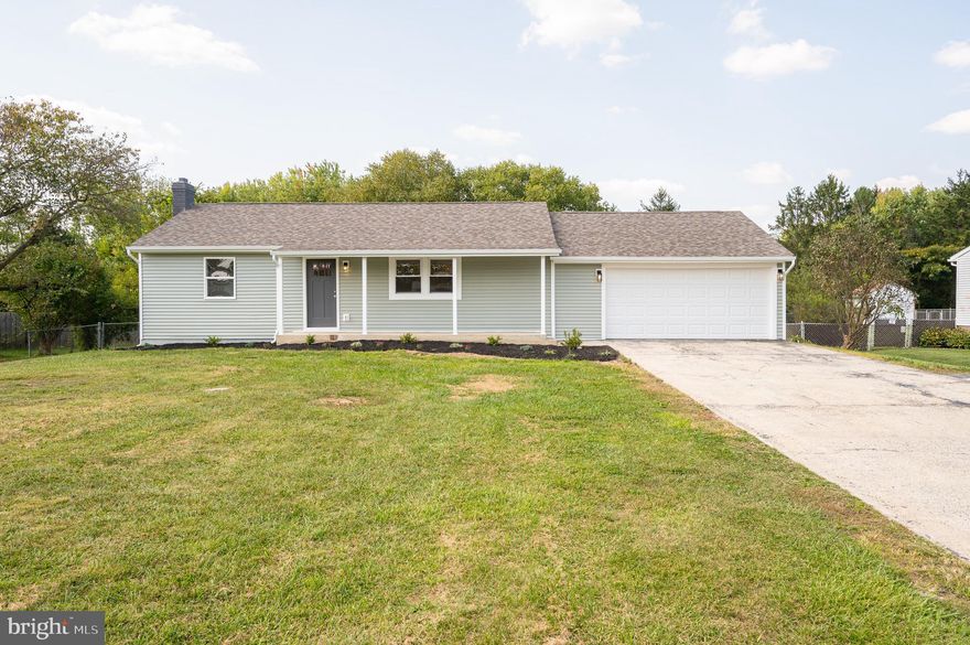 Welcome to this charming 2 bed 1 bath rancher located on a quiet street in Falling Waters, WV.  The home has recently been renovated both on the exterior and interior and is ready for its new owner.  Renovations include new siding,  architectural shingle roof, exterior doors, garage door, gutters/downspouts, soft close kitchen cabinets with quartz counters + Samsung stainless steel appliance package, interior doors/trim, new HVAC system, new water heater, recessed lighting, LVP flooring, carpet, tiled bath/plumbing fixtures. The layout features an open concept which is perfect for entertaining.   Downstairs you will find additional living space and a large laundry room.  Enjoy sitting under the covered porch that overlooks the fully fenced back yard.