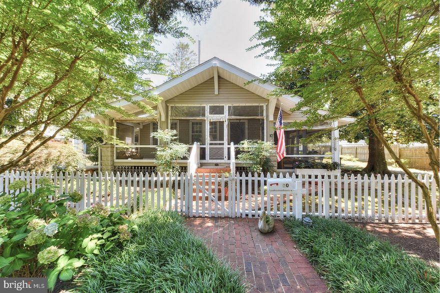 Ocean block in the Pines! The quintessential coastal cottage awaits at 10 Columbia Avenue. Only a short distance from the soft sand and crashing waves, this home is perfectly positioned on a double lot close to everything Rehoboth Beach has to offer. Shaded by beautiful mature trees, this cottage was built in the 1920s and has been lovingly maintained by the same family since the 1940s. The picket fencing, stunning magnolias and hydrangeas, and spacious wrap-around screened porch add to the homes personality. Original hardwood floors, a wood-burning fireplace with a white brick surround, and unique trims and moldings decorate the main house, which consists of 3 bedrooms and 3 recently updated baths. The home's expansive screened porches supply the most generous spaces for gatherings, entertaining, or simply relaxing. Just steps from the main house, you will find a private guest house with 1 bedroom, half bath, outside shower, and full laundry. With a separate storage shed, several storage nooks, a partial basement, and floored attic, this property offers room to grow. This property has great potential and an excellent ocean block opportunity!