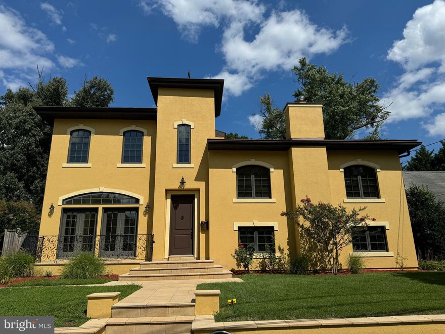 OFFERS DUE TUESDAY NOON.Exquisite French style and elegance infuse this unique home which delights at every turn. Every detail has been curated to evoke the sophistication of Mediterranean homes. From the bespoke wrought iron exterior railings to the fanciful main level chandeliers, and the herringbone patterned hardwoods, this property is magnificent. The expansive garden is a peaceful delight filled with fragrant verbena, peonies, hydrangeas, flowering trees and shrubs. 
As you pull up, take note of the ochre Dryvit façade and the Rooster weathervane that sits atop the highest point of the roof and moves with the breeze. Upon entering, a two-story foyer leads directly to the formal living room / dining room entertaining space with gorgeous herringbone patterned Red Oak hardwoods and two lovely chandeliers. Down the hall, a true chef’s kitchen featuring exotic granite and an island opens to a breakfast area that is adjacent to French doors leading directly to one of the patios. Moving further along, a spacious and sunny family room - or, if you prefer, the formal dining room. 
A few steps down, you will enjoy the TV room with fireplace, and the bedroom suite with bath is a perfect au pair room, or long term guest room. The laundry room is bright.
Up one level, two spacious bedrooms with a shared full bath. The top floor features at wide hallway designed as an art display area. From the top of the two-story foyer hangs a striking contemporary mobile by the DC-area sculptor David A Yano. The fourth bedroom comes with an ensuite full bath. At the end of the hall, you will fall in love with the enchanting primary bedroom suite, complete with a roof top terrace over looking the deep yard and green space below. Everything about this home is unique and thoughtfully designed.
Many green features including "Eco-Star" roof made from durable recycled tires,.  Sold As Is.
Located less than 1/2 mile from the Wildwood shopping center, with Balduccis gourmet grocery store and many specialty shops, nearly there is also Giant Supermarket, DSW Shoe Warehouse, the YMCA, the Lycee Rochambeau, and a mile down the road, the expansive Westfield Montgomery Mall. Convenient to 495 for easy access to all the airports and the many destinations that make the DC area the perfect place to live.