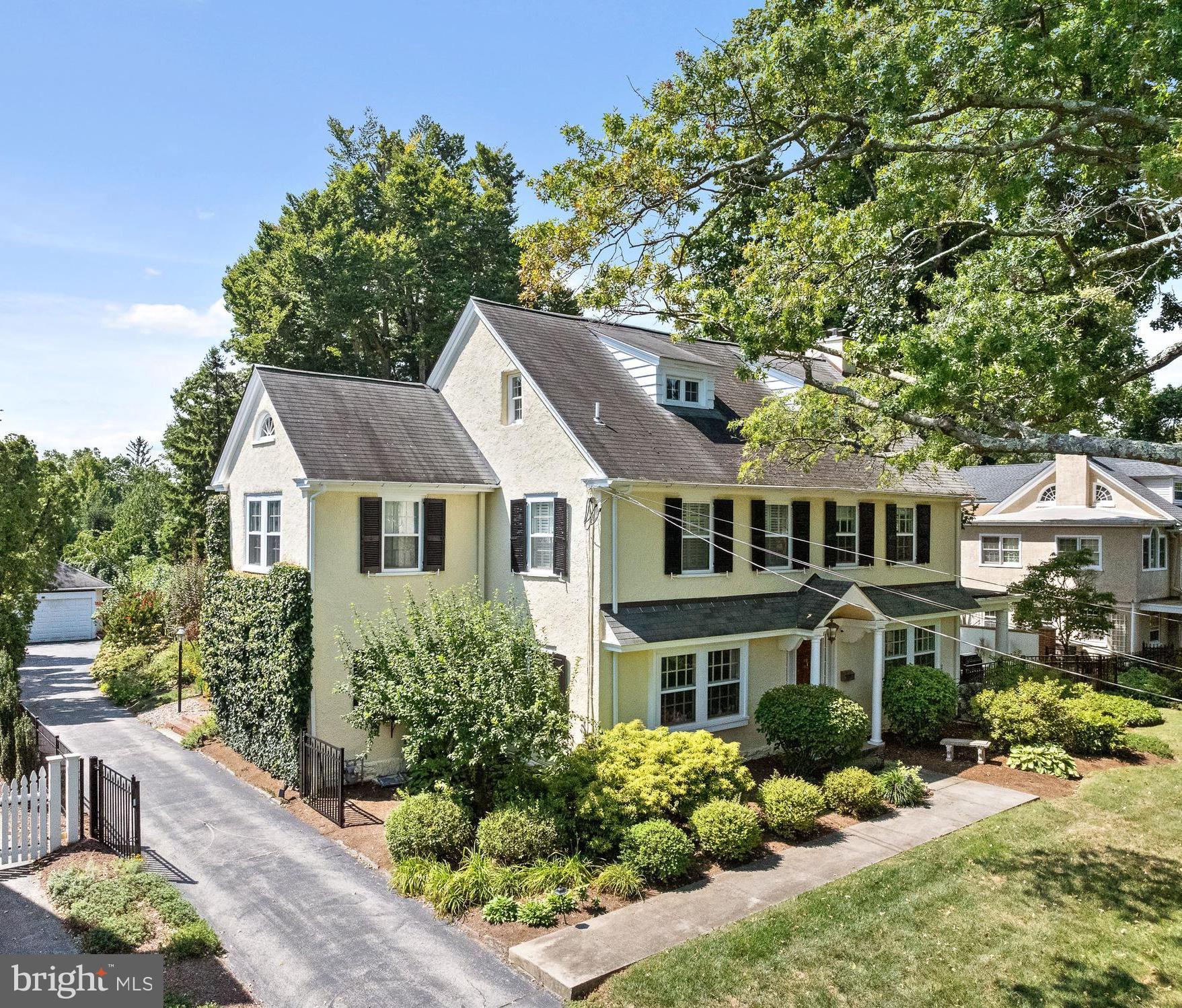 NEW PRICE Don't miss this opportunity! Experience refined living at its finest in this remarkable home, where the charm of timeless architecture meets modern convenience, creating the ultimate dream home for families looking to plant roots in one of Wayne's most sought-after neighborhoods. This 5-bedroom, 3.5-bathroom Colonial masterpiece, in the award winning Radnor school district , sits on a serene .49-acre lot, offering the privacy of a gated sanctuary while keeping you steps away from the Radnor trail , through your own private gate, perfect for outdoor family fun and daily walks, as well as Wayne’s vibrant town center and train station
Step inside and be greeted by the grand foyer, with original hardwood floors and soaring ceilings which sets the tone for a home that’s as stylish as it is inviting. The sun-drenched living room is a perfect blend of cozy and elegant, with oversized windows framing views of lush greenery and a white brick hearth with a convenient gas fireplace, perfect for family nights or hosting friends. Open the French doors to your own covered terrace, for morning coffees, al fresco dining with summer BBQs, or just relaxing under the stars.
The spacious formal dining room, adorned with chair rail, and crown moldings, seamlessly flows into the kitchen where white cabinetry, gleaming carrera marble countertops, and stainless steel appliances create a bright, functional space with an additional staircase to the second level and a convenient breakfast eating space
The second-floor primary suite is your personal escape, offering a spa-like bathroom with a freestanding soaking tub, dual vanities, and a custom walk-in closet. Two additional bedrooms and a beautifully renovated bath complete this level—perfect for a growing family. The third floor offers more flexibility with two extra bedrooms—ideal for a home office, playroom, or guest suite.
The finished lower level offers space for a home gym, game room, or movie nights, along with a spacious separate laundry room and ample storage
Step outside and be surrounded by century-old trees and formal gardens, with a spacious yard fully fenced, for the kids to run and play, a designated dog run, and direct access to the Radnor Trail through a private gate on the property for daily adventures. A detatched 2 car garage sits at the end of the driveway and has parking for 3 additional cars!
This home offers an unbeatable combination of elegance, space, and walkable convenience to top-rated schools, dining, shopping, and parks—everything young families and out-of-town buyers could wish for.
Perfect location for access to all major commuter routes including Philadelphia airport, Center City Philly Rtes 476, 76, PA turnpike and New York