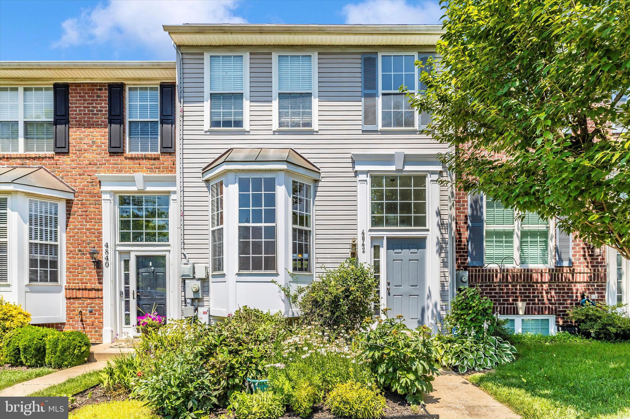 Welcome to this spacious three-level townhome in the highly sought-after Wellington Trace neighborhood. Featuring four bedrooms and three and a half baths, this beautifully maintained home offers bump-outs on all three levels, fresh neutral paint, and brand-new carpeting throughout. The large kitchen boasts upgraded cherry cabinetry, Corian countertops, and hardwood floors. The fully finished walk-out lower level includes a generous family room and a full bath—perfect for guests or entertaining. Step outside to enjoy a beautifully landscaped yard and a spacious deck that backs to open space for added privacy. This move-in-ready gem is not to be missed!