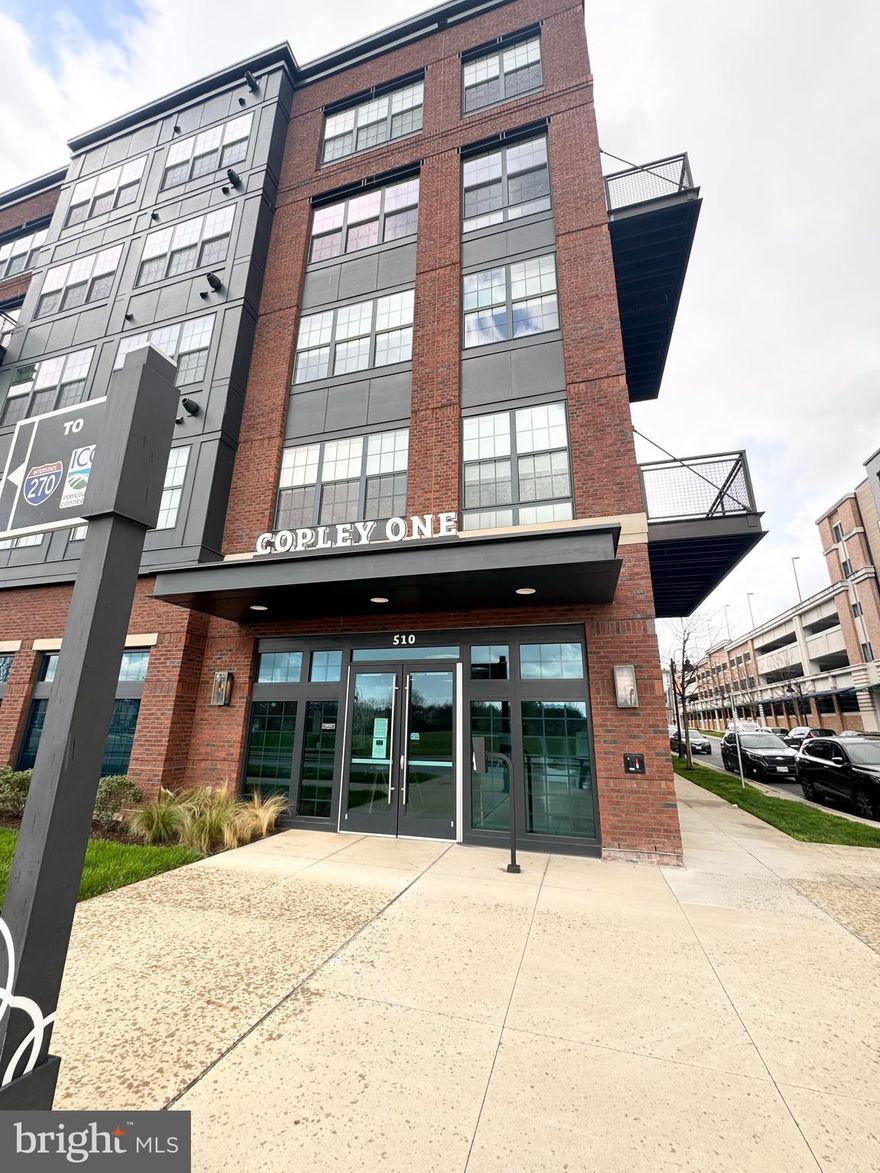 Welcome to this stylist urban condo featuring 1 bedroom plus a versatile den, perfect for a home office, guest room or a cozy retreat. Located in the heart of the vibrant downtown Gaithersburg in Crown!  This condo, in the highly sought-after Copley building at Crown, offers both convenience and comfort.  Upon entry, you're greeted by an open-concept living space adorned with sleek engineered hardwood floors and large windows, bathing the interior in natural light.  It features an open-layout design, maximizing space and natural light flow. The well-appointed kitchen boasts stainless steel appliances, quartz countertops, ample storage, making meal preparation a breeze.  The spacious bedroom offers a serene escape with engineered hardwood floor, a spacious walk-in closet and easy access to the luxurious full bathroom.  The den, strategically positioned for privacy, offers endless possibilities, whether you're working from home or housing overnight guests.  This rare gem in Copley features a unique and coveted amenity - a private patio that leads directly to a picturesque courtyard.  Step outside and immerse yourself in a serene oasis, surrounded by vibrant greenery and peaceful ambiance.  The patio offers a secluded retreat for al fresco dining, morning yoga sessions, or simply basking in the tranquility of your surroundings.  With this exceptional feature, this condo offers a lifestyle of luxury and serenity that is truly unparalleled in the urban landscape.  Additional highlights include in-unit laundry, a designated parking spot, your own entrance to the private courtyard, steps from retail stores, a few minutes away from Rio, ICC, I-270 and free shuttle service to Shady Grove Red Line Metro Station.  With its prime location near trendy cafes, restaurants and retail stores, this condo presents an unparalleled opportunity to experience the city at its finest.  Don't miss this out on the change to make this urban oasis your new home!