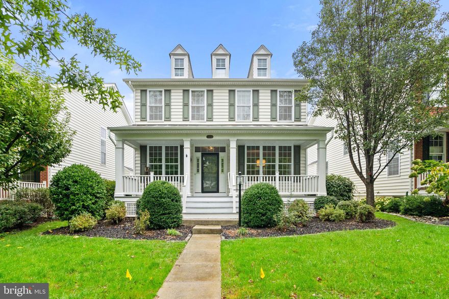 Discover this impeccably maintained model home in the sought-after Dominion Valley Country Club. This beautiful residence offers a perfect blend of nostalgic elements, southern charm, and modern conveniences. Enjoy the ease of a maintenance-free front porch, ideal for sipping your morning coffee. Step inside to find an open and airy floor plan filled with natural light. 

The main level features plenty of versatile living space, including a formal dining room and sitting room. The gourmet kitchen is a chef's dream, featuring stylish cabinetry, granite countertops, an elegant backsplash, and upgraded stainless steel appliances. A breakfast room with a bay window provides a casual dining area. Relax in the spacious family room, complete with a gas fireplace. Gleaming hardwood floors add a touch of elegance throughout the home. A main-level laundry room and mudroom lead to a private back deck and a two-car rear-load garage. Upgraded light fixtures and neutral paint create a welcoming atmosphere. 

Upstairs, the luxurious owner's suite features an elegant tray ceiling, a large walk-in closet, and a spa-like ensuite bath with upgraded tiles. Three additional spacious bedrooms and full bath complete the upper level. 

The finished basement offers a huge recreation room, a full bath, an egress window, and ample storage space. The property also features easy-to-care-for landscaping. For added peace of mind, the upper-level HVAC and dishwasher were both replaced in 2023.

Experience the world-class amenities of Dominion Valley Country Club, including an Arnold Palmer Signature Golf Course, renovated Clubhouse, state-of-the-art Sports Pavilion, five swimming pools, tennis and basketball courts, playgrounds, miles of walking and biking trails, and two fishing ponds. Living in Haymarket, VA offers a delightful blend of small-town charm and modern convenience. Enjoy the serene countryside setting, with plenty of outdoor recreational opportunities.

This is the one you've been waiting for! Schedule a private tour today.