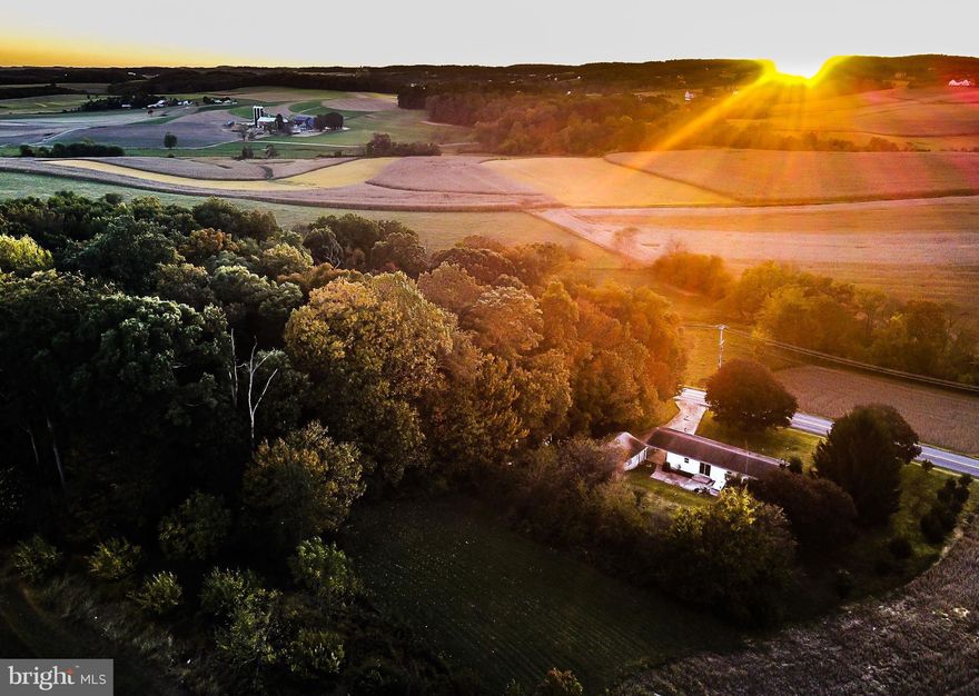 One story living on 2+ acres with quiet pastural views.  Newly painted inside and out and new front walkway.  Very private on all sides.  Abundant parking with an attached carport, detached garage and plenty of parking space in the driveway, perfect for work vehicles.  Minutes to shopping and restaurants.  Full unfinished basement with high ceilings, finish it any way you would like.  Property truly lives and feels much larger than it is.