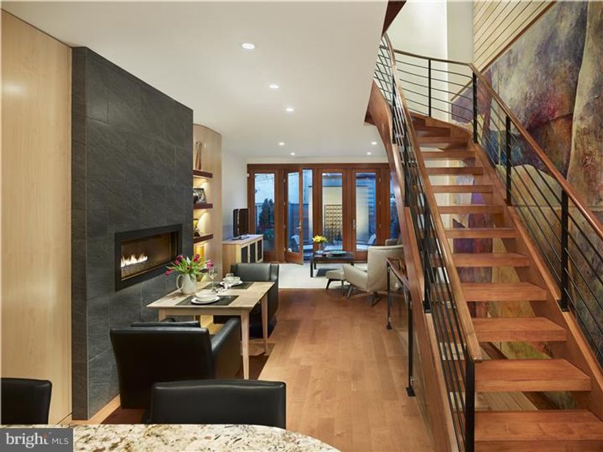 The preeminent LEED Platinum residence in the city. This dramatic, custom 3 bedroom plus den, 3.5 bath home is just perfect. Superior finishes, ideal layout. A Most desirable, quiet tree-lined block. Spacious and serene patio (plus a 2nd floor balcony and a 3rd floor walkout deck with skyline views). This home was completely renovated, expanded, and rebuilt in 2012 with the finest custom finishes throughout. Tasteful, livable, sustainable, important, brilliant. All new systems, mechanicals, electric, plumbing (including radiant floor heating throughout). Wide-plank hardwood floors. The spectacular custom staircase is a true work of art. High-ceilings. Beautiful kitchen with an exceptional lighting fixture by award-winning lighting designer Arturo Alvarez, solid maple cabinetry, granite counter-tops and eating bar, 36" Wolf range, SubZero refrigerator, Miele dishwasher, micro-tile backsplash, oversized farmhouse sink. Pantry closet. Every space is smartly utilized. The Open 1st floor plan also offers a dining area with custom fireplace and a spacious living room with a wall of windows overlooking the bluestone patio (with irrigation system). 2nd floor master suite with walk-in-closet, marvelous bath, and balcony. There are two other bedrooms, each with a gorgeous full bath. Den with wet bar and walkout deck. Finished lower-level with office space. One of the rare homes in the city awarded LEED Platinum. Sustainable features include Solar Panels on roof (provide approx. 25% of electricity), 3-bike storage shed with green roof, energy efficient appliances and mechanicals, water-saving fixtures and toilets, amazing natural light, and more. Excellent storage. 3-zone high-efficiency Central Air and ultra-high efficiency radiant floors throughout. Lutron Whole-House Lighting System. LED down-lights throughout. This home was expanded from its original design and substantially rebuilt (historically approved). Tax Abatement on all improvements through 2022. An A+ location in the Greenfield School Catchment, and a most desirable and lovely Fitler Square neighborhood. This is a quiet block with minimal traffic. One block from Fitler Square. Convenient walk to many restaurants; coffee shops; dog park; Schuylkill River Park, Trail, and brand new Schuylkill Banks Boardwalk; super-markets; Rittenhouse Square; Penn, HUP & CHOP, 30th train station and--just everything. 95 WalkScore, 100 Transit Score, 99 Bike Score.  Seller offering 2- yr. pre-paid PARKING at 22nd & Pine.