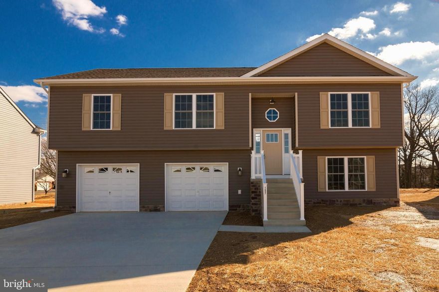 CONSTRUCTION IS COMPLETE AND THE HOME IS MOVE IN READY. THIS SPACIOUS SPLIT FOYER DESIGN OFFERS NEARLY 2,100 sq. ft. OF FINISHED LIVING AREA AND FEATURES A SPLIT BEDROOM DESIGN WITH A GREAT ROOM FEATURING CATHEDRAL CEILING SEPARATING THE MASTER SUITE FROM BEDROOMS #2 AND 3. THE EAT IN KITCHEN HAS UPGRADED CABINETRY, GRANITE COUNTERS, STAINLESS STEEL APPLIANCES, GARBAGE DISPOSAL AND AN ISLAND WITH OVERHANG FOR STOOLS. THE SPACIOUS MASTER SUITE FEATURES HIS AND HERS WALK IN CLOSETS, TRAY CEILING & CEILING FAN AS WELL AS A MASTER BATH WITH A DEEP SOAKING TUB & A SEPARATE OVERSIZED SHOWER, DOUBLE SINK VANITY, PRIVATE WATER CLOSET AND LINEN CLOSET. THE TREMENDOUS, OVERSIZED FINISHED TWO CAR GARAGE HAS AN INSULATED GARAGE DOORS , TWO AUTOMATIC GARAGE DOOR OPENERS AND PLENTY OF SPACE FOR ADDITIONAL STORAGE SHELVING / WORKBENCHES, ETC WHILE STILL ALLOWING PLENTY OF SPACE TO PARK TWO CARS.  THE FULLY FINISHED BASEMENT FEATURES A SECOND MASTER SUITE / FAMILY ROOM WITH A THIRD FULL BATHROOM AND WALK IN CLOSET. ALL OF THIS LOCATED IN AN UPSCALE DEVELOPMENT WITH SIDEWALKS, CURB & GUTTER, CONCRETE DRIVEWAYS AND INDIVIDUAL SIDEWALKS. CALL TODAY TO ARRANGE TO VIEW THIS HOME AND BE IN BEFORE THE HOLIDAYS. PLEASE NOTE THAT PHOTOS ARE OF SIMILAR CONSTRUCTION. ADDITIONAL BUILDING LOTS AND FLOOR PLANS TO CHOOSE FROM...