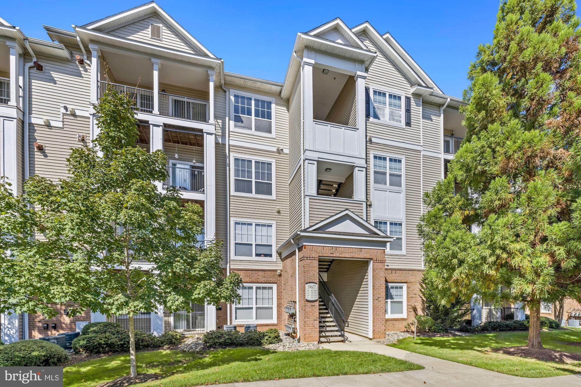 This is a fresh and bright one bedroom condo, built in 2006 but feels like it is new! This is a TURNKEY unit, with a balcony that has a gorgeous view high above the trees, brand new luxury vinyl plank flooring and fresh paint. The kitchen is outfitted with ample modern cabinetry and a brand new fridge, opening up to the sunfilled living room so the chef doesn't miss a beat! A distinctive feature, this condo offers a built-in home office workspace, built in display shelves, and a deep inset for the dining area so it feels apart from the living room and special. Bedroom has a huge double-sided walk-in closet and a full sized washer/dryer area with additional built-in storage. The Ashmore community is a real plus: an outdoor pool, generously equipped gym, and a clubhouse, plus it is pet friendly and FHA pre-approved! Assigned parking space + guest pass. Conveniently located just off Father Hurley Blvd. and minutes from major routes of 355, I-270, the myriad of dining options on Germantown Road and the Black Rock Center for the Arts.