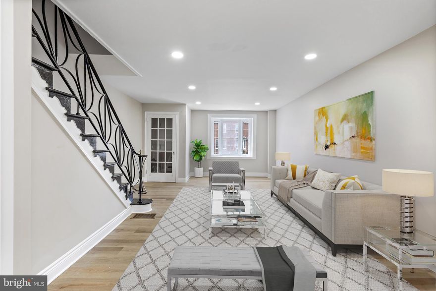 Hurry to see the nicest home in the area.  Totally updated throughout 3 bedroom 2.5 bath row in absolute mint condition.  Enter through the foyer and feel the "Home Sweet Home" feeling as you enter into the spacious living room, dining room, powder room and brand new ultra modern kitchen with brand new GE stainless steel appliances.  The upper lever has good size rooms.   The main bedroom in front has great space and greets the morning with plenty of sunlight;  two more good size bedrooms all with ceiling fans.   There is a brand new 3 piece hall bathroom with walk in shower.   The lower level has been opened and remodeled for a spacious rec room with a brand new full bath.   The heater closet hold brand new appliances.   Brand new heater and central air (which most homes in the area don't have c/a).   New flooring throughout. Conveniently located near shopping areas, bus stops, city schools and blocks away from the rec center.  Ask you agent about First Time Buyer Programs and other Grant Money to help you purchase this dream home.