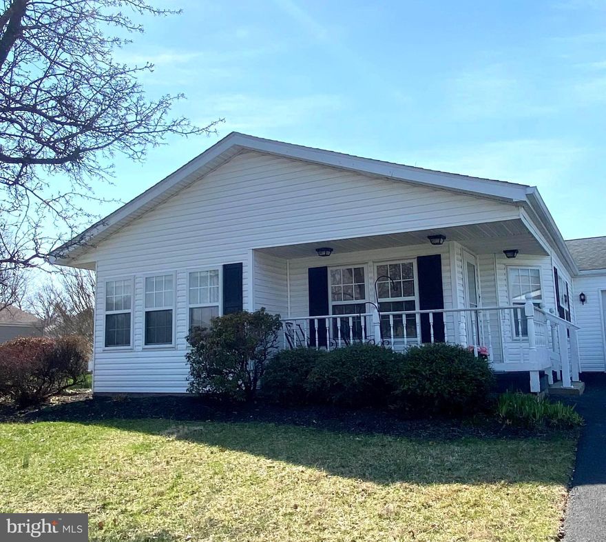 Desirable 2-bedroom Chalfont model on a corner location has all the space you need to make it your new home! Inviting porch so you can visit with neighbors or watch the world go by. The beautiful Morning room with gleaming oak hardwood flooring and lots of windows lets the sunshine in! This is truly a flex space that can be a sitting area to enjoy coffee with friends, a home office, or whatever your imagination desires! The open floor plan flows seamlessly from one room to the next. The Living room and Dining area offer plenty of space to entertain for the holidays. Dining area has updated LVP flooring. The convenient Kitchen has plenty of cabinet and pantry space, plus a vaulted ceiling with 2 wonderful skylights. The spacious primary Bedroom suite has a large walk-in closet plus a linen closet. The attached Bathroom offers a soaking tub and stall shower, plus 2 updated sinks, an updated toilet, and updated LVP flooring. The second Bedroom has new carpet and 2 closets. The hall Bath has an updated tile walk-in shower, updated sink, updated toilet and updated LVP flooring. The Laundry room has updated LVP flooring and loads of cabinet space for extra storage, plus a new (2025) dryer. The in-demand garage provides ample space to park a car, plus some built-in shelving for storage. Extra-long driveway for when friends come over! Roof (Fall 2012), HVAC (Fall 2012), Water Heater (2019), updated screen door. Owner has made updates as noted and maintained the house well during their ownership. A variety of colorful flowers bloom throughout the yard. And of course, Buckingham Springs offers so many amenities, from the refreshing pool and hot tub, to the gym, clubhouse, and variety of fun social events - what’s not to love?! This house is ready for your personal finishing touches – make your appointment now, before it’s gone!