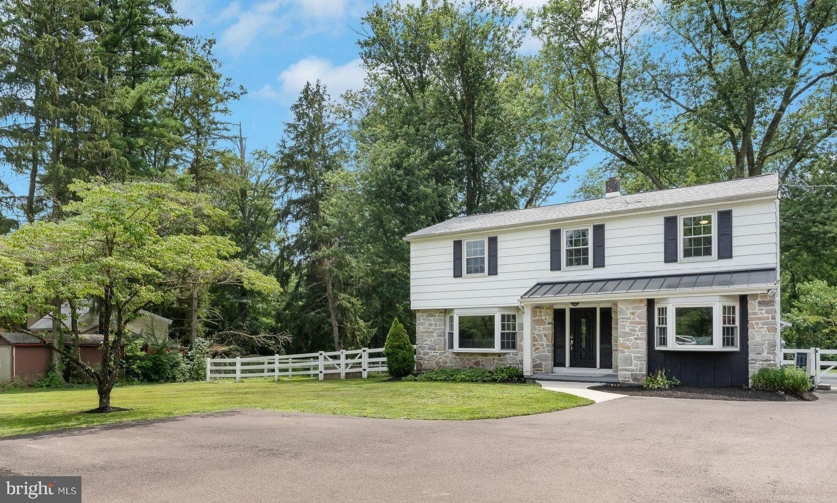 Don’t miss this farmhouse-inspired colonial located in the award-winning Central Bucks School District, situated on nearly an acre of manicured grounds. Guests are greeted by freshly mulched flower beds surrounding the covered front entry. The main floor features an attractive open floor plan connecting the living, kitchen and dining areas. A large bay window in the spacious and comfortable living room & glass sliding doors to the rear exterior, in the dining area, provide an abundance of natural light throughout this space. A well-placed pellet stove adds literal and figurative warmth to this cozy area. The bright kitchen features plenty of cabinet space, granite countertops with large peninsula, stainless steel appliances, subway tile backsplash and a farmhouse sink. A family room/den, half bathroom and sizable laundry area can be found on the first floor as well. Upstairs, the primary bedroom suite boasts a walk-in closet, full bathroom and brand-new carpet. Three additional well-appointed bedrooms, and an additional full bathroom complete the upper level. The charming sunroom will extend your enjoyment of the private backyard oasis deep into all four seasons! This space has tons of flexibility and is just waiting for your imagination. Outside, a stamped-concrete patio, complete with fire-pit and sitting wall, overlooks the expansive rear yard enhanced with PVC split-rail fence (with chicken wire) installed around the perimeter. A large 12 x 24 shed and a 3-car carport are convenient for covered vehicle and additional storage. Many upgrades have been made in recent years including brand new carpet in the family room, stairs and primary bedroom (2025); stamped concrete patio (2021); fencing around perimeter of rear yard (2021); wood laminate plank floors (2021); extensive landscaping & grading (2021); wood pellet stove (2020); new concrete walkways (2020); roof with metal standing seam accent (2020); kitchen remodel including cabinets, countertops, appliances (2019); and high-efficiency heat pump HVAC (2019). This special property is just a mile from John Paul Park, Lions Pride Park & Igoe Porter Wellings Memorial Field. Shopping, dining, nightlife and community events are only minutes away on route 611 in Warrington and in historic Doylestown Borough. Low property taxes make this property more affordable than most. Easy access to PA Turnpike & Route 202, as well. Book your showing today!