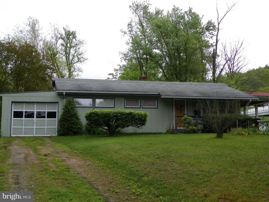 Great house with a separate workshop in a quiet neighborhood that sits on a nice 1.31 acres lot. House features 3 bedrooms 1 bath, central A/C, a huge hallway, full basement, separate carport and attached garage. There is a separate workshop with a 2 car garage underneath for a total of 3 garages. Make your appointment today