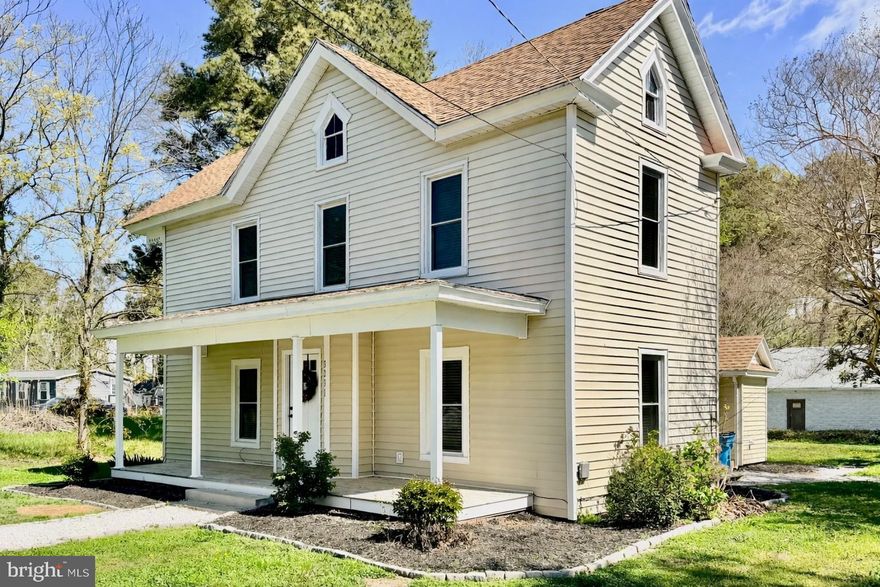 Welcome to 3231 Lawsonia Road! Set on 1.67 peaceful acres just beyond the town limits of Crisfield, this thoughtfully updated home features timeless farmhouse character with today’s must-have upgrades. A wide front porch creates a welcoming setting, while an extended gravel drive leads to an oversized detached two-car garage with a large workshop space with electric, water, storage above, and a garage door opener. Walking in through the front door, the interior is bright, open, and full of warmth. Generously sized windows fill the main living area with natural light, complemented by a pellet stove that adds both efficiency and cozy charm. The layout flows seamlessly into a large dining area with plenty of room to entertain. And then on to the modern kitchen designed for both function and style, featuring granite countertops, stainless steel appliances, subway tile backsplash, soft-close cabinetry, a large center island, and pantry storage. A versatile room on the first floor offers flexibility for a home office, playroom, or potential fourth bedroom. Nearby, a full bathroom with tile flooring also houses the laundry area, with washer and dryer conveying, along with a utility room providing additional storage. Upstairs, a charming reading nook anchors the second level and leads to three well-sized bedrooms and a full hallway bath. The primary suite includes two closets—one walk-in—and a private en-suite bath with a double vanity. Extensive improvements from a major renovation done in 2024 enhance both comfort and peace of mind. This includes new luxury vinyl plank flooring, new carpet, fresh paint throughout, all new windows, a new water heater, partial roof and gutter replacement, four new ductless mini-split systems on the first floor, central heating and air on the second floor, updated bathrooms, and ceiling fans in the bedrooms - all done just over a year ago. Every space has been carefully considered, offering a move-in-ready home with room to breathe, work, and unwind. This is country living with modern convenience—best experienced in person.