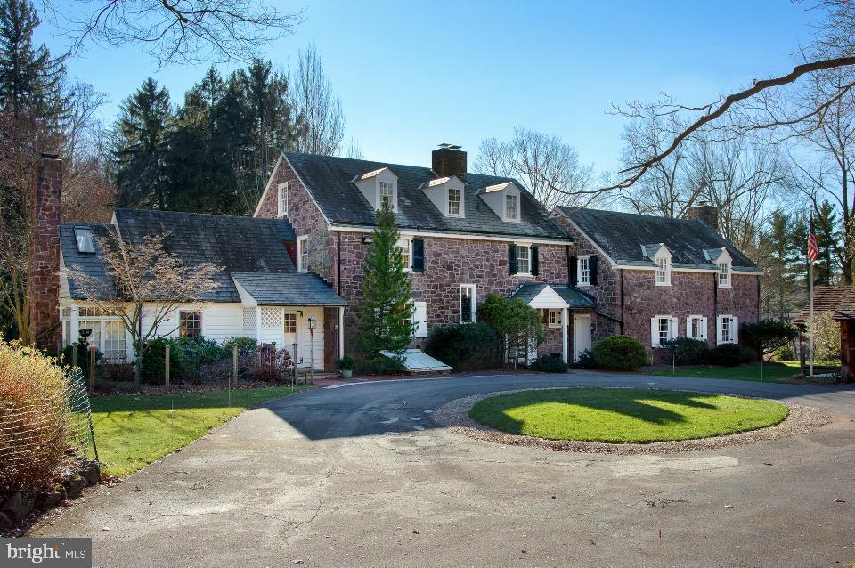 An exquisite stone home situated on 11 beautiful acres of woodland, meadow and lawn provides complete privacy while minutes from all conveniences and major roadways. This home offers 6 bedrooms, 4.5 baths, 3 fireplaces and hardwood floors throughout the more than 5,000 sq. ft. of living space. A custom eat-in kitchen has cherry and glass cabinetry, a granite island, a sitting area with floor to ceiling stone fireplace and expansive views.