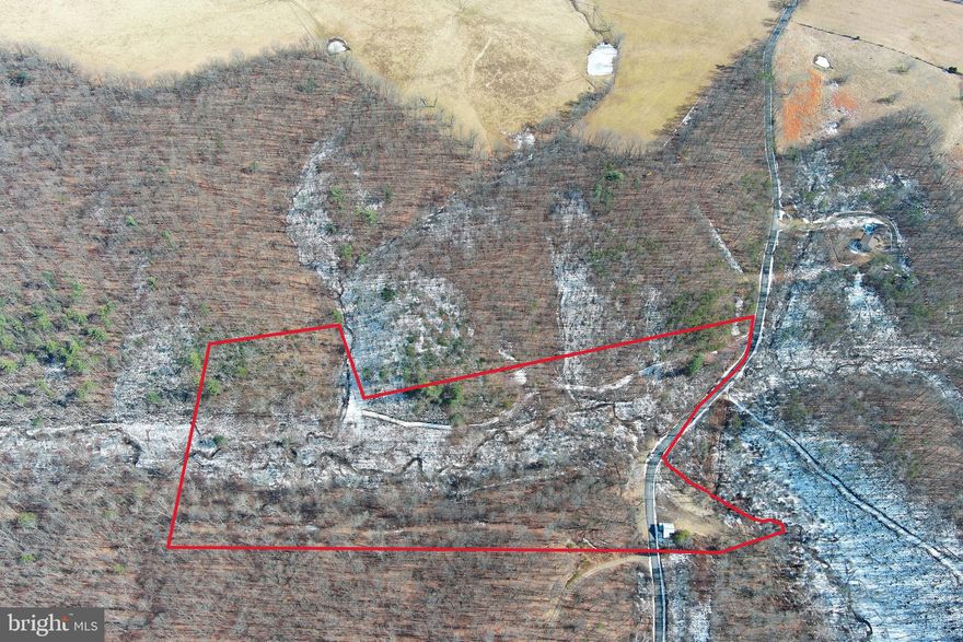 NO RESTRICTIONS + NO HOA = NO PROBLEMS! 16.5 UNRESTRICTED ACRES WITH A LITTLE BIT OF EVERYTHING; SEASONAL STREAM, GOOD TOPO, WELL, ELECTRIC, PAVED ROAD FRONTAGE. LONG DRIVEWAY THROUGH WOODS LEADS TO CAMP/BUILD PAD OR TAKE ADVANTAGE OF WELL & ELECTRIC AT THE OLD HOUSE, A COUPLE OPTIONS TO PULL IN YOUR CAMPER IMMEDIATELY. TINY HOME, BIG HOME, MOBILE HOME, MODULAR HOME.....BUILD WHATEVER YOU HAVE IN MIND. PERFECT HOME BASE FOR THE RV CROWD....EASY ACCESS VIA WIDE PAVED COUNTRY ROAD. HUNT, SHOOT, ATV'S....YOU CAN DO ALL THE FUN STUFF HERE.....NEW SURVEY....GREAT COUNTRY LOCATION BUT NOT FAR FROM ANYTHING. IT'S NEXT TO IMPOSSIBLE TO FIND UNRESTRICTED PROPERTY THESE DAYS.....HERE'S YOUR CHANCE TO LIVE FREE WITH NO RULES, RESTRICTIONS OR RESPONSIBILITIES!