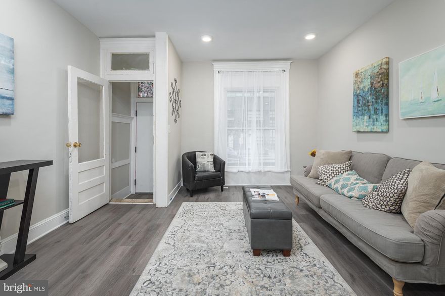 Welcome to a classic Remington beauty. The classic porch-front house features quaint original charm with many modernized updates throughout. Cute and inviting vestibule welcomes you into a large living room with an oversized window, updated with new trendy distressed floors, leading into a separate dining room and a state of the art kitchen with gray shaker cabinets, exotic stone counters, brushed gold hardware and stainless appliances. Second floor offers three large bedrooms updated with all new carpeting and a large bathroom. Private backyard is great for family gatherings and cookouts. Perfectly and conveniently located in Remington, close to The Avenue, Johns Hopkins, Baltimore Downtown and all major highways.