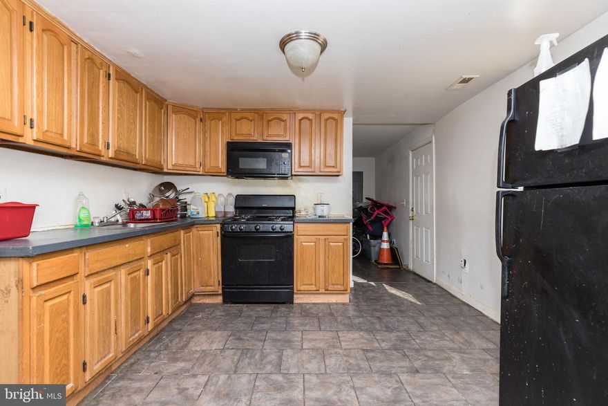 INCOME PRODUCING 3 LEVEL TOWNHOME WITH OVER 2,300 SQ. FT. OF LIVING SPACE!  Property is being sold with tenant in place - Section 8 tenant with a monthly rent of $1,900.  Main level features a spacious living room, separate dining room, large kitchen, full bath, and rear mud room or den.  2nd level has 3 large bedrooms and 1 full bath and the 3rd level has an additional 2 bedrooms.  Perfect opportunity to add to your rental portfolio!