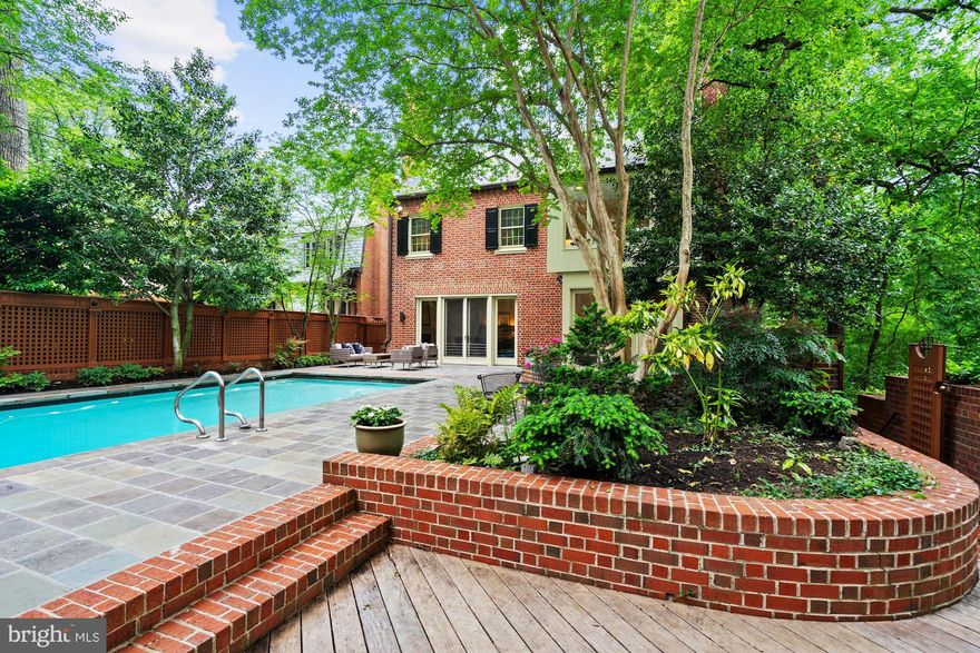 The photos are great, but can't convey the fabulous sense of space and light here - this is a "must see"! Welcome to this gorgeous and detached federal with heated pool on a prime and coveted Kalorama block. Four finished and light-filled levels with approximately 5,500 square feet of beautiful space are found in this lovely residence. High ceilings, large windows, six fireplaces, handsome millwork, gleaming hardwood floors and a large attached two-car garage are among the highlights. This home offers a fabulous flow for entertaining and everyday living. Large formal rooms include a gorgeous paneled library with fireplace, and living and dining rooms, also with fireplaces, both with floor to ceiling windows overlooking the beautiful grounds and pool. An updated and spacious kitchen with a breakfast area is also found on the main level. A very generous master suite with fireplace, large dressing and bath area also overlooks the grounds and shares the second level with another two bedrooms, one with a fireplace and an ensuite bath, and a laundry room. The third level features another two bedrooms, each with ensuite bath, a cedar closet and large storage area. A beautifully finished lower level has its own separate entrance and includes a family room with a fabulous walk-in fireplace, dining area and 2nd kitchen and access to the grounds and pool. A bedroom with bath, large storage room, utility room, second laundry and access to the two-car garage are also on this level. Residents enjoy nearby Rock Creek Park as well as easy access to the shops and restaurants of Connecticut Avenue, Dupont, West End, Georgetown and more. Rock Creek Parkway, Connecticut and Massachusetts Avenues provide easy commutes to points in DC, VA and MD. This is the perfect spot for those hoping to find a private retreat with all of the conveniences of the city just around the corner.  3D Tour and Virtual tour link are attached.