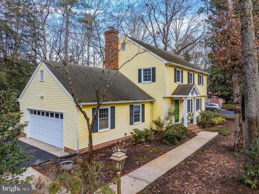 Situated on an elevated homesite in Deer Harbour, 3940 Devonshire Drive offers privacy, thoughtful design, and beautiful natural surroundings in an amenity-rich community. Mature landscaping surrounds the home, and the outdoor brick patio serves as a wonderful entertaining space—perfect for gatherings, outdoor dining, or simply enjoying the peaceful setting and abundant wildlife that frequent the lush backyard. Inside, a bright and airy sunroom with cathedral ceilings, skylights, and a dramatic palladium window captures serene views and flows seamlessly into the kitchen and family room. The family room features a raised-hearth fireplace with a striking mantel, custom built-ins, and a wet bar, creating an inviting space for entertaining or relaxing evenings at home. The kitchen offers quality cabinetry, solid surface countertops, and a well-designed pantry, with the formal dining room conveniently nearby. A spacious living room with additional built-ins provides flexible gathering space, while a powder room and an oversized laundry room with extensive cabinetry and workspace complete the main level. Upstairs, the primary suite offers a private retreat with its own full bath featuring a custom shower. Two additional bedrooms share a second full bath, including an oversized bedroom originally designed as two separate rooms and thoughtfully combined into one expansive space with a built-in desk, shelving, and a full bookcase wall. The attic includes a fully insulated storage room with a door, providing valuable enclosed storage. Additional features include a generous one-car garage and a conditioned crawl space with insulation and vapor barrier for added efficiency and protection. Deer Harbour residents enjoy exceptional community amenities including a golf course, basketball court, tennis courts, pickleball court, common grounds, pavilion and picnic areas, playground, and access to community waterways for homeowners and their guests. The pond is stocked periodically, the golf course is open to residents with no reservations required, and all amenities are available from dawn to dusk. A paved driveway and beautifully maintained grounds complete this well-cared-for one-owner home.