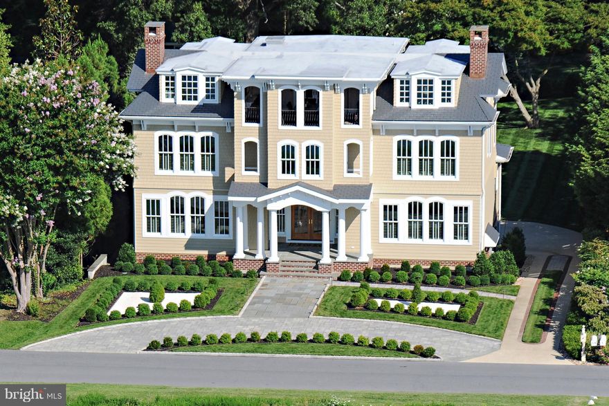 Spectacular views of Chesapeake Bay from this dramatic setting in Bay Ridge.  Elegant residence for the discerning buyer -- architectural millwork and moldings, custom hardwood floors, sweeping staircases and curated fixtures create a feeling of warmth and well-being.  Enjoy the views from large windows that provide wonderful light and an airy feeling throughout the home.  Large rooms with marvelous flow and cook's kitchen for entertaining in style.  There is an elevator to all 4 levels including the top floor with covered loggia looking out to the Bay, luxurious master suite on the second floor; lower level with in-law/nanny suite, storage and 3-car garage.  A perfect place to call home!
