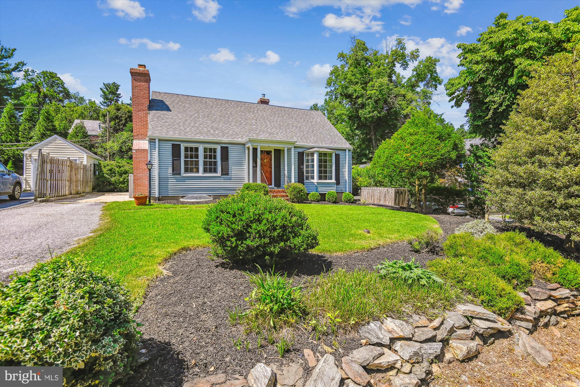 Embrace the serenity of this peaceful retreat, where tranquility reigns inside and out.
Tucked away in picturesque Ruxton, this delightful 3-bedroom, 2-bath Cape Cod seamlessly blends classic charm with thoughtful modern updates. A sun-filled, flexible floor plan provides comfortable living for a variety of lifestyles. Warm hardwood floors, timeless architectural details, and carefully curated improvements enrich every room. The spacious living room features a cozy wood-burning fireplace, while the inviting dining room is accented by custom built-in china cabinets. At the heart of the home, the beautifully remodeled kitchen (2022) impresses with all-new cabinetry, tile, flooring, and lighting—designed for both everyday functionality and effortless entertaining. Enjoy the versatility of a charming garden sunroom and a tranquil screened porch—perfect spots to relax, read, or host guests. Step outside to a level, sun-drenched backyard ideal for morning coffee, alfresco dining, or playtime with your four-legged companion. The main level also includes a bright study/office/family room, a comfortable bedroom, and a full bath. Upstairs, you’ll find recently refinished wood floors, two generously sized bedrooms and a second full bath. The finished lower level expands your living space with a remodeled recreation room (2022), dedicated workspace, laundry area, and ample storage. Additional recent improvements include new air conditioning (2021), upgraded electrical system (2021), and a new roof and gutters (2022), offering peace of mind for years to come. Nestled in a close-knit neighborhood known for its sense of community, with easy access to shopping, dining, and scenic walking trails. Live as though you’re a world away in this secluded oasis—just minutes from everything you need. Welcome home!