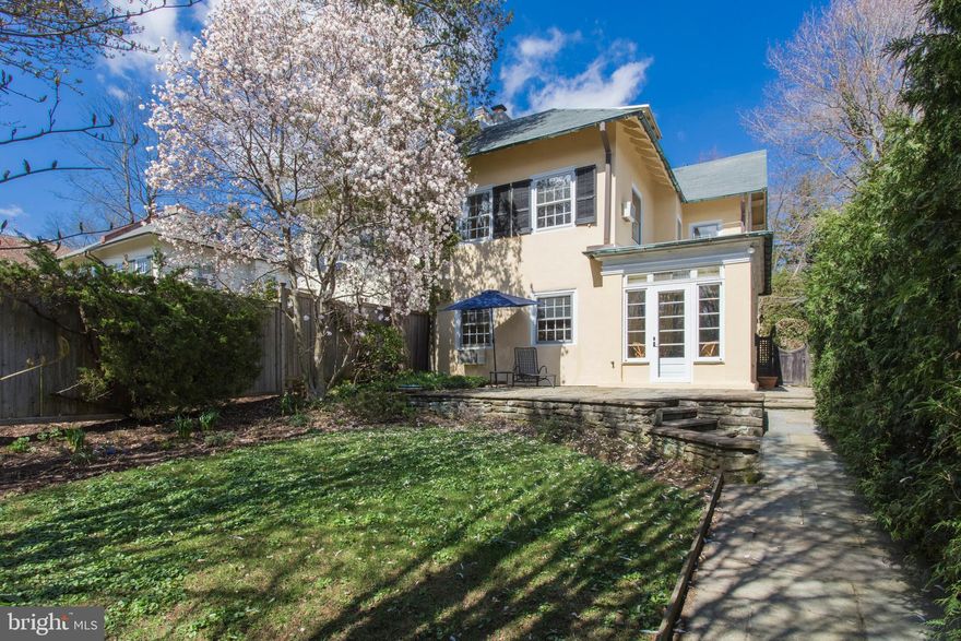 Rarely offered 1923 twin on most desirable, quiet Top-of-the-Hill block. One of just four similar semi-detached homes, this one stands out with its sunny southern exposure and very private setting. Enter via a  foyer with tile floor to a living room with fireplace and lovely adjacent sunroom.  Across the way is the formal dining room leading to the kitchen and powder room.  The updated kitchen has granite counters, stainless-steel appliances, a large pantry/cupboard, and oak floors.  The second floor has 3 bedrooms and 2 full baths. The main bedroom has a walk-in closet and private access to the main bath, which also opens onto the hall.  Between bedrooms 2 and 3 is another full bath with tub/shower.  On the third floor are 2 very large bedrooms and a hall bath with clawfoot tub.  There is central air on the second and third floors that also cools the first floor.  (Two older through-the-wall air conditioners are not in use). The beautifully landscaped gardens are compact and  very manageable, with front & back patios.  A detached 1-car garage is accessed via a shared private driveway entered between 8717 and 8719 Shawnee St.  A very special home on one of Chestnut Hill's best blocks, so close to everything that makes the Hill a great place to live.