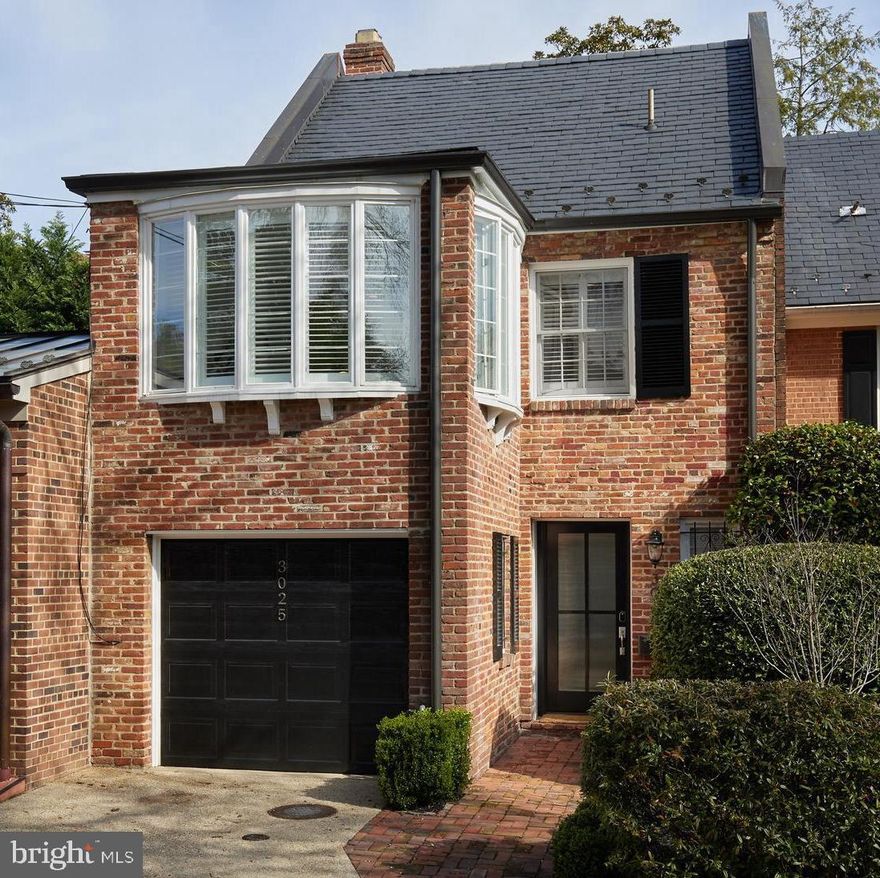 Tucked away in the coveted East Village of Georgetown, this singular townhome with attached garage is a quiet sanctuary on Orchard Lane. Renovated by renowned architect Dale Overmyer, the glass ceiling of the gourmet kitchen - Viking and Subzero appliances and quartz countertops - and dining area dazzles with natural light.  French doors flanked by floor-to-ceiling windows lead to the private patio and garden with mature plantings and a majestic magnolia. From the large living room with fireplace, stairs lead to upper level one with two large bedrooms and one bath; one bedroom includes a lovely bright sitting room or office. Upper level two is a large ensuite bedroom. Steps from restaurants and parks, walk less than a mile to the Dupont Metro station.