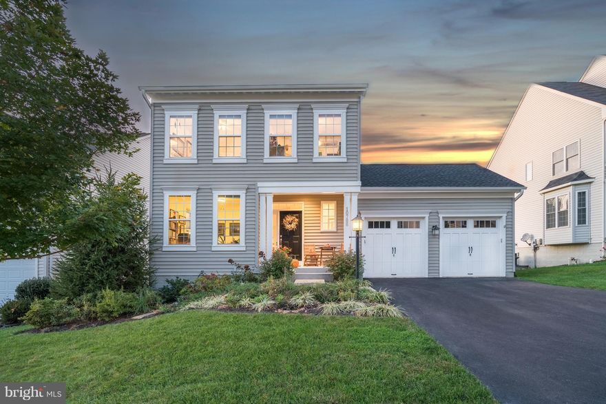 Stanley Martin Home Coles Run Manor w/ well appointed features. Wonderful open design. Gourmet kitchen w/granite counter tops,large island,NEW SS appliances, & sit up bar. Home office, hardwood floors, gas fireplace in the family room. Laundry RM upper level. NEW Gorgeous landscaping w/ garden beds. NEW patio door leads to costume 2 tiered deck to watch the sunsets. 40 year roof. walkout basement.