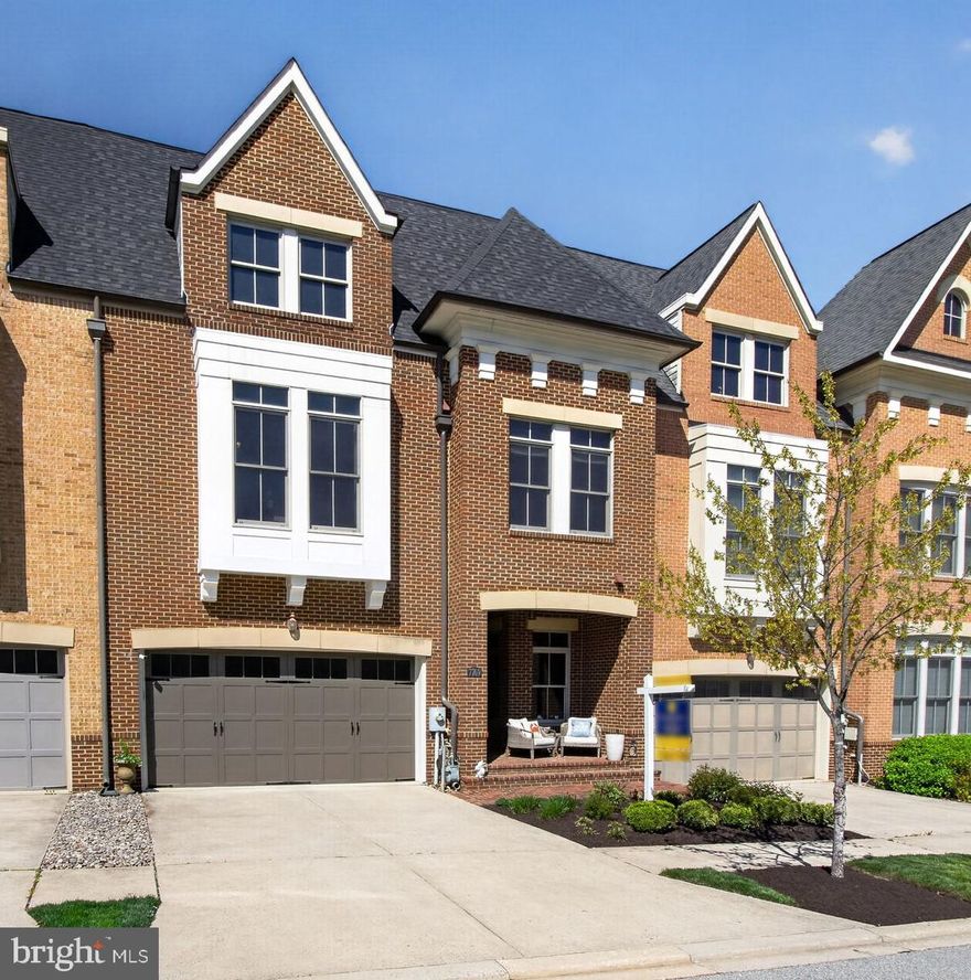 Discover an exquisite blend of luxury and comfort in this stunning 4-bedroom, 3.5-bathroom townhouse nestled in the prestigious Maple Lawn community. Built in 2010, this home boasts an impressive 4500 sq. ft. of meticulously designed living space, featuring elegant crown moldings, high ceilings, hardwood floors, and a gourmet kitchen equipped with stainless steel appliances, a double oven, and a spacious island perfect for culinary enthusiasts. Relax in the inviting family room with a cozy gas fireplace or unwind in the opulent primary suite, complete with a soaking tub and walk-in shower. Two decks offer a perfect spot to host special events or simply enjoy a relaxing sunset or morning coffee.  Many recent updates include the Roof (2019) Custom Painting (2018) LVP and Carpet in the Lower Level (2018) Refrigerator (2025) Heat Pump/Air Handler - 2nd floor (2026) Garage Door Painted (2026) Refreshed Landscaping (2026).  Step outside to enjoy the community's luxurious amenities, including a sparkling pool, fitness center, and tennis courts, all set against a backdrop of serene, tree-lined views. With a premium lot backing to a lovely pond, this home offers an exclusive lifestyle that seamlessly blends elegance with everyday living. Experience the pinnacle of refined living today!