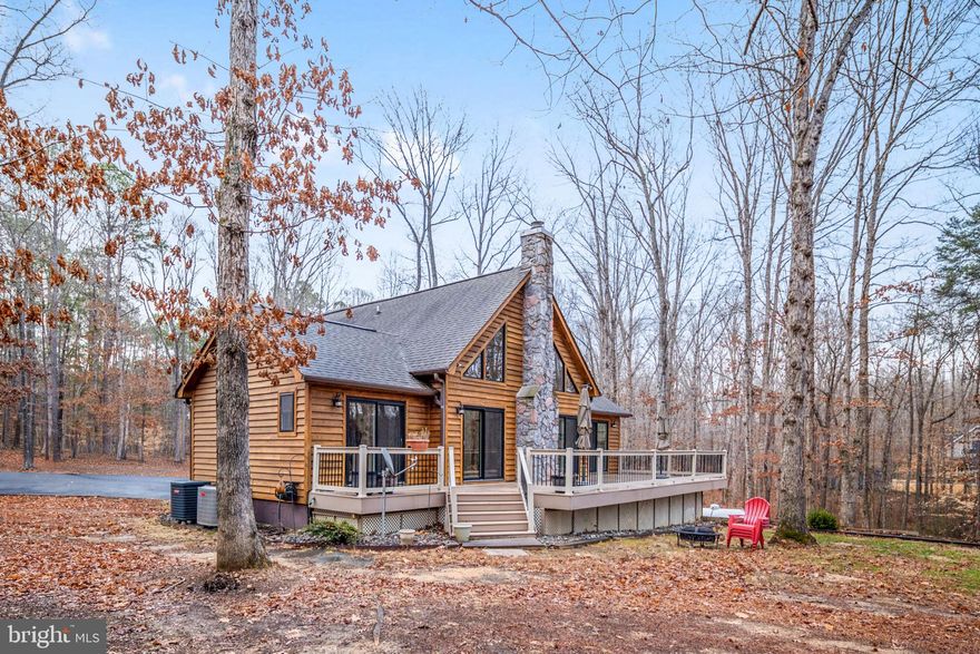 Welcome to 10706 Ropers Run on the highly sought-after south end of the public side of Lake Anna, Virginia. This is the widest and deepest part of the lake, making it ideal for boating, swimming, and full lake enjoyment.

This 3 bedroom, 3 bathroom two-story water access home offers main level living with an open concept design. The bright kitchen features white cabinetry, fresh new paint throughout, and flows seamlessly into the dining area and living room. Large windows and a beautiful fireplace create a warm, inviting space that opens to a spacious back deck overlooking peaceful nature and wildlife.

The primary suite is conveniently located on the main level with a private bath. An additional bedroom and full bathroom are also on the first floor. Upstairs, you will find a bonus living area, an additional bedroom, and full bathroom, offering ideal privacy for guests.

Outside, enjoy a large paved driveway with plenty of room for boats, trailers, and guest parking. The property includes an attached one-car garage, a detached two-car garage, and additional storage sheds for all your lake toys.

Boat slips are available through the HOA common area, which is just steps from the home, providing easy Lake Anna water access. Short-term rentals are allowed, making this a strong investment opportunity. High-speed internet is available, and you are just minutes from restaurants and conveniently closer to Spotsylvania Courthouse and shopping.

Do not miss this opportunity to own on the most desirable side of Lake Anna. Watch the video tour and schedule your private showing today.