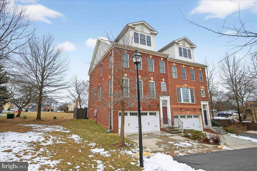 Experience luxury and convenience in this private end-unit colonial brick townhome in the desirable Whitestone Marshall Heights, ideally located in the heart of Falls Church. This premium beltway setting offers a rare combination of suburban peace and urban accessibility. The main and first upper-level floors feature rich cherry wood flooring, while the lower and second upper levels are quietly carpeted. The main level highlights 9-foot ceilings, three walls of windows that flood the space with natural light, refined crown molding, and custom plantation shutters. The bright open layout invites relaxed living and effortless entertainment with the kitchen as the heart of the home. It showcases 2023 dual zoned HVAC systems, GE stainless steel appliances, a double wall oven, French style refrigerator with water/ice, an over-the-range microwave, granite countertops with a seamless backsplash, expansive kitchen cabinetry, and a practical island with dual sinks. The kitchen opens to the neighboring family area, which centers on a three-sided gas fireplace and a sliding glass door that leads to the cozy upper deck and the fully fenced backyard.

The primary bedroom suite occupies an entire level, offering two walk-in, a sitting room/office area, and a luxurious en-suite spa-like bath, with an in-level washer/dryer closet for added convenience. The second level hosts two additional bedrooms that share a Jack-and-Jill bath with dual vanities and a combination shower/tub. The fully finished lower level provides flexible space with a half bath, suitable as a game room, gym, rec room, or media area. A spacious two-car garage with two extra driveway parking spaces completes this home. Tucked away at the end of a cul-de-sac, this townhome offers excellent privacy and tranquility.

Beyond the home, you’ll enjoy easy access to dining, shopping, and entertainment options including Tysons Mall and Tysons Galleria, with nearby grocers such as Trader Joe’s, Lidl, Harris Teeter, Whole Foods, and Wegman’s. Major commuting routes—I-495, I-395, I-66, and the Dulles Toll Road—are readily accessible, and the property sits between the Silver Line’s McLean Station and the Orange Line’s West Falls Church Station, with a WMATA bus line at the doorstep for convenient transit. Dulles International and Reagan National airports are roughly 30–40 minutes away. The area is served by highly rated schools at Lemon Road Elementary, Kilmer Middle School, and George C. Marshall High School, top-ranked in Virginia. This is a truly turnkey home that combines sophisticated living with unmatched location. Call to schedule a private tour or for more details.
