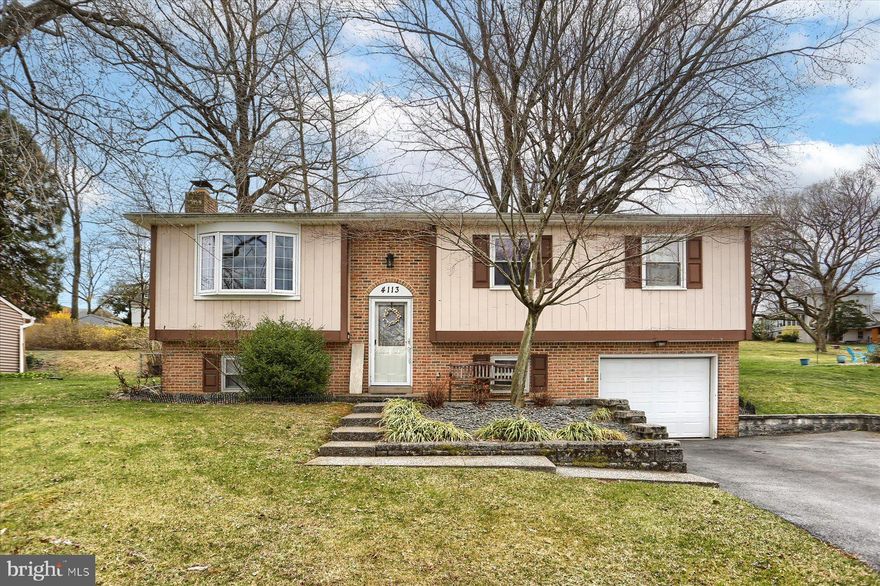 Welcome to this well-appointed bi-level home, offering both comfort and convenience in a wonderful neighborhood.  With four spacious bedrooms, two and a half baths, and a thoughtfully designed layout, this home is perfect for anyone seeking to enjoy an ideal blend of private living and easy access to everyday amenities.  As you step inside, you'll be greeted by an ample living room, and a bright and airy combination kitchen and dining room, ideal for hosting gatherings or enjoying family meals.  The kitchen flows seamlessly into a charming sunroom,  with a space to add your own  bar — the perfect spot to unwind or entertain guests. A large deck off the sunroom provides ample space for outdoor dining, relaxation, and enjoying warm evenings.  The lower level of the home is a true standout, offering an enormous recreation room featuring a cozy wood-burning fireplace. This versatile space is perfect for creating a family movie night setting, a game room, or a peaceful retreat.   Additionally, the one-car garage adds extra convenience and storage space.  Situated on a great lot with a fenced in backyard, this is the perfect place for pets  and guests to enjoy!  Located in Central Dauphin School District, and just minutes from shopping centers, restaurants, and other local amenities, this home offers the perfect balance of suburban tranquility and urban convenience.  Don’t miss out on the opportunity to own this beautiful home in an unbeatable location!