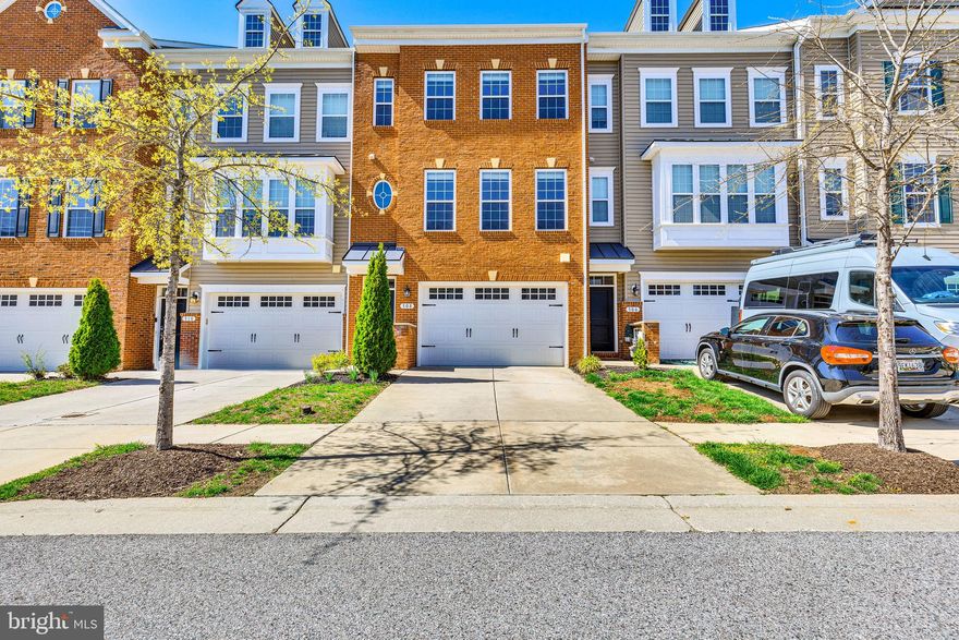 Come see this GREAT brick front, 3 bedroom, 2.5 bath Luxury Townhome in the highly sought after neighborhood of Creekstone Village!  From the moment you arrive you'll love the 9 foot ceilings on all 4 levels, hardwood flooring throughout too. The main level is complete with a gourmet kitchen with its HUGE kitchen island with quartz countertops,  energy star stainless steel appliances that include a cooktop, 2 wall ovens, built-in microwave, double sink, dishwasher, refrigerator, and kitchen pantry.  Next to the kitchen is the dining room and powder room.  Also the family room with a gas fireplace for cozy nights at home and there is also a door out to the private balcony to enjoy your morning coffee.  Upto the 3rd floor you will find the 3 bedrooms, 2 full bathrooms and the convenience of the laundry room.  The primary suite has two walk-in closets, ceiling fan and an en-suite bathroom with a double vanity, separate shower and water closet.  The other two bedrooms also have ceiling fans and a guest bath.  The 4th level has the awesome loft that has a closet,  a roughed-in for a  bathroom AND the "Sky Loft" where you can go to relax and oversee the entire neighborhood in complete privacy.  The fourth level could be used as your home gym, office or your 4th bedroom.  The lower level is finished and is the perfect playroom, yoga studio, you name it.  It has a slider out to the backyard and also the door out to the 2-car garage.  There is also a rough-in for another bathroom. All of this and the HOA fee for Creekstone Village includes the community pool, club house, walking trails, two playgrounds, lawn maintenance and a dog park!  All of this and the location can not be beat, you'll be close to shopping restaurants and commuting routes as well.  Check out the virtual tour!