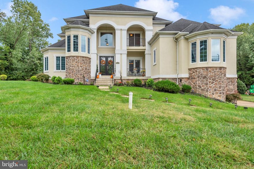 Unrivaled, Unmatched, Unforgettable, Lakefront Luxury in TANTALLON ON THE POTOMAC... Experience timeless elegance and refined living in this extraordinary five-bedroom, four-and-a-half-bath luxury residence offering over 11,800 square feet of beautifully appointed space on a 0.41-acre lot with captivating water views of Swan Creek, which opens to the Potomac River. Designed with sophistication and comfort in mind, this home showcases gleaming wood floors, ceramic tile, and a rear stone patio ideal for outdoor entertaining. The stately hip roof with high-end shingles and three-car garage with extended storage complement its architectural grace.

The grand foyer sets the tone with sweeping sightlines into the formal living room, adorned with floor-to-ceiling windows and a central fireplace that floods the home with natural light. The butler’s pantry seamlessly connects the formal and casual spaces, leading to the gourmet kitchen, featuring a large island, gas cooktop, wall oven, stainless steel appliances, and recessed lighting. The eat-in kitchen flows effortlessly into the family room and out to the wrap-around deck, creating a perfect setting for intimate gatherings or grand celebrations. A main-level bedroom with a full bath, private office, and elegant powder room complete this level.

Upstairs, the primary suite serves as a luxurious retreat with a tray ceiling, fireplace, private rear balcony, and dedicated storage room. The spa-inspired en-suite bathroom features a soaking tub, double shower, dual vanities, and a spacious walk-in closet. Additional bedrooms include a balcony overlooking Swan Creek, walk-in closets, and a Jack-and-Jill bath designed with comfort and style.

The finished lower level is a haven for recreation and relaxation, boasting a theater room with Bose surround sound and projector, a fitness room (mirrors and TV convey), recreation room, bonus room, and mudroom easily adaptable to a dog-washing station. Additional highlights include two HVAC systems, a commercial-grade sump pump with battery backup, side yard walkout, and garage access.

Located near the Tantallon Marina for boating enthusiasts, this home offers proximity to Colin Powell Academy, Fort Washington Park & Ride, and Fort Washington Village Shopping Center, with convenient access to Route 210 (Indian Head Highway), I-495, and I-295, ensuring an easy commute to Washington, D.C., and Virginia. This exquisite estate harmoniously blends luxury, comfort, and location—offering a lifestyle of distinction along the serene waters of Swan Creek.