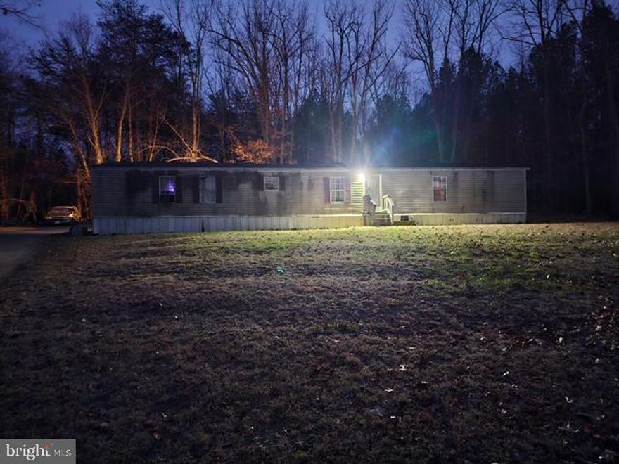 Investor Opportunity with Income in Place!
1997 Manufactured/mobile home offering 3 bedrooms/2 full baths, situated on a private 1.74 acre lot with a deck and cleared surroundings. Property is being sold with an active tenant lease, providing immediate rental income for the new owner.

The home is serviced by a private septic system and a community well located on the property, which also supports two adjacent lots. The original 6-acre parcel was legally subdivided and recorded with Louisa County, offering clarity on parcel history and utilities.

With ample acreage, established utilities, and tenant occupancy, this property presents a solid opportunity for buy-and-hold investors seeking land value, rental income, or future redevelopment potential (buyer to verify).

Do not disturb tenant. Showings by appointment only.