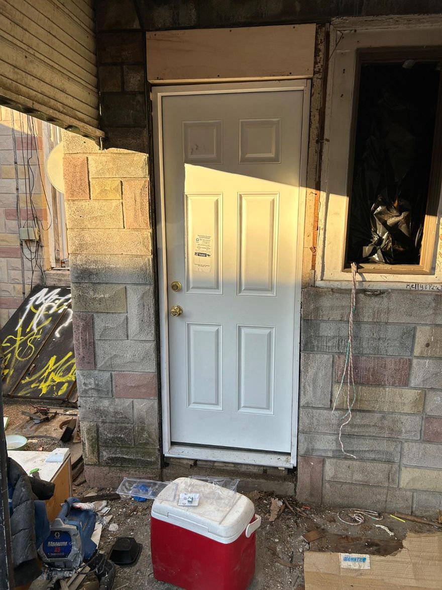 Property is being sold AS-IS. Buyer is responsible for removing all remaining garbage and debris. Buyer must bring appropriate tools, including a drill, to remove the front board in order to gain entry to the property.
