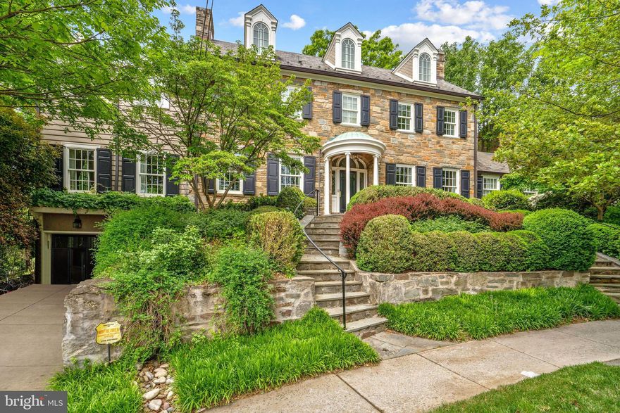 Elegantly positioned on a secluded cul-de-sac in Mass Ave Heights surrounded by lush greenery, this distinguished Flagstone Colonial residence, meticulously cared for over the past 22 years, is now available. The main level is designed for entertaining, boasting a gracious foyer, a generously sized living room with a fireplace, a sunlit family room featuring a wet bar and wine fridge, and access to a rear veranda. Additionally, there is a formal dining room, a private study, a gourmet eat-in kitchen fully updated in 2019, a powder room, and a sunlit breakfast area with French doors leading to the terrace. Upstairs, the expansive owner's suite includes two recently renovated en-suite full baths and two walk-in closets with built-ins. The fully finished lower level, renovated in 2019, offers a second kitchen, a private and sunlit office with a built-in desk, an additional recreational room, laundry facilities, and a two-car garage. This 6 BD | 6 BA | 2 HB residence harmoniously combines timeless elegance with modern amenities for a truly exceptional living experience.