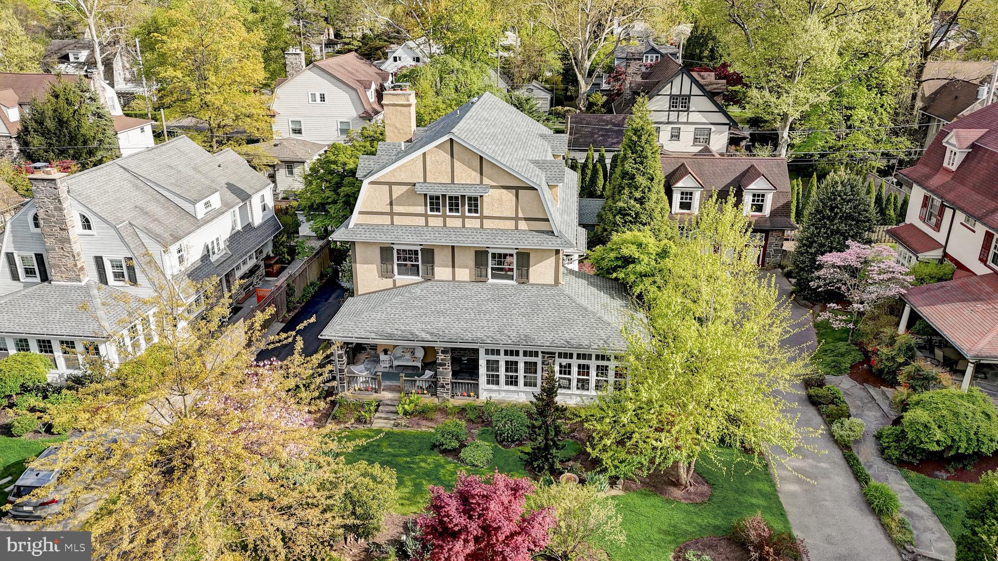Nestled on one of Bala Cynwyd's most beautiful & desirable streets you will find 112 Penarth Road. This stunning, extremely well-maintained 5 bedroom, 3.5 bathroom stone-accented Dutch Colonial is framed by beautiful seasonal plantings which enhance its picturesque setting. As you enter you are welcomed by the large enclosed sunroom with a cozy gas fireplace. The large windows invite the outdoor landscape inside, making it a perfect living space, entertaining space,or a fabulous home office sanctuary. Continue into the sun drenched family/living room complete with beautiful hardwood floors, large windows with deep window sills, 12' ceilings & a wood-burning stone fireplace. Beautiful hardwood flooring continues into the large dining area with a charming bay window. The dining area opens into the updated kitchen complete with beautiful custom wood cabinetry, Dekton counters, custom ceramic backsplash, double oven, recessed lighting, stainless appliances & breakfast bar. Just off of the kitchen is a mudroom where you can stow all your gear or grab your coffee as you go out the rear door, which leads to a detached 2-car garage & charming backyard garden area. A convenient half bath completes the main level. A beautiful wooden staircase leads to the 2nd floor which offers 3 very generously-sized bedrooms, one of which has an ensuite bathroom & dressing area, plus an updated full bathroom in the hall. Continue to the 3rd floor where you find a spacious Primary Bedroom with a large walk-in closet & a spa-like ensuite bathroom with soaking tub & shower. Two additional rooms complete the 3rd level, which could be used as offices, your personal workout area or more! The large unfinished basement presents lots of possibilities both for future living space as well as storage areas. 112 Penarth Road is conveniently located close to shopping, restaurants, parks, entertainment & more! Just minutes to the Cynwyd Elementary School, Bala Cynwyd Library & the Cynwyd Heritage Trail. Enjoy a short commute into the city- whether you choose to drive or take the train from the Cynwyd Station. This is a stunning property in an amazing neighborhood! Book your appointment today!