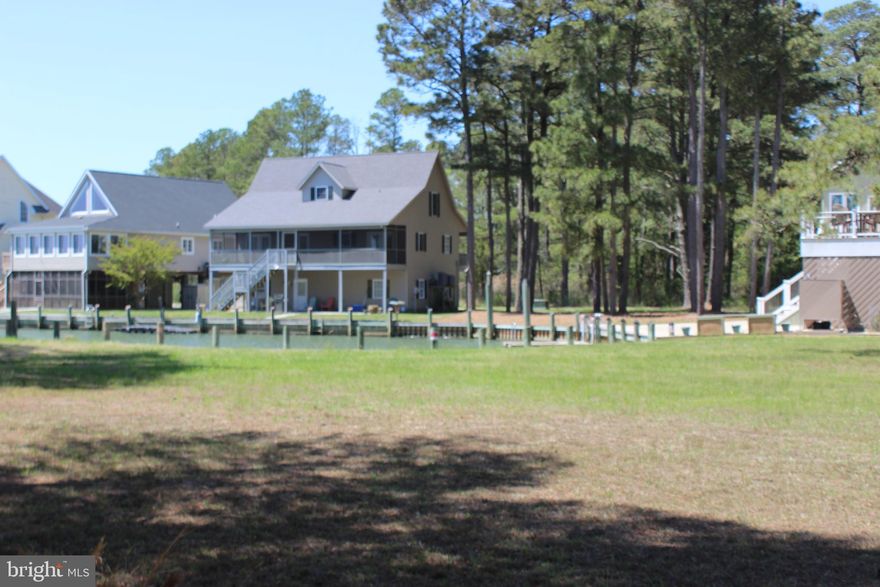 1/800 Imagine sitting on your back deck and looking across a canal that leads out to the Chincoteague Bay, from your front porch glimpses of the Chincoteague Bay...then look no further?  Approximately 25' bulkhead. Lot has water & sewer availability. No time frame to build and no builder tie-in. Come and enjoy all the amenities and the lifestyle of the Eastern Shore of VA, close to Chincoteague Island, Wallops Island and Ocean City MD. Captains Cove is the fastest growing Golf & Waterfront community on the Eastern Shore of VA. HOA amenities: 9 Hole Pristine Golf Course, indoor/outdoor pools (2), fitness center, tennis, basketball and Pickle-ball courts, playground, boat ramp, biking & walking trails, dog park, security and so much more. Call for information