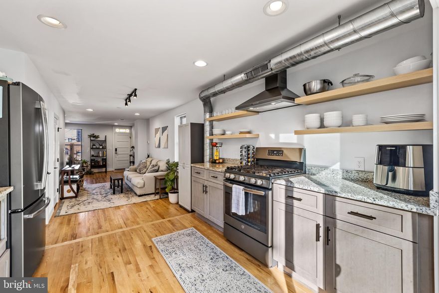 This modern and airy end-of-group rowhouse was completely renovated in 2018. Located on a quiet one-way  street in Canton, this versatile home has an open, mail level floor plan. Anchored by hardwood floors, an exposed brick wall, stained glass transom, and half-bath, the living room extends into the well designed kitchen that flows onto the patio with access to a one car garage.  The second floor has two, nearly identical bedrooms and two identical hall bath rooms with a laundry closet. The lower level has ample storage with a concrete floor and access to all the house systems. Centrally located, you can easily walk to Patterson Park, Canton Square, grocery stores, shops, a hardware store, coffee shops, restaurants, and the waterfront. This home is currently rented and subject to the terms of the lease, which terminates at the end of January 2024. This home has a low rate assumable loan. Contact the listing agent for more details.