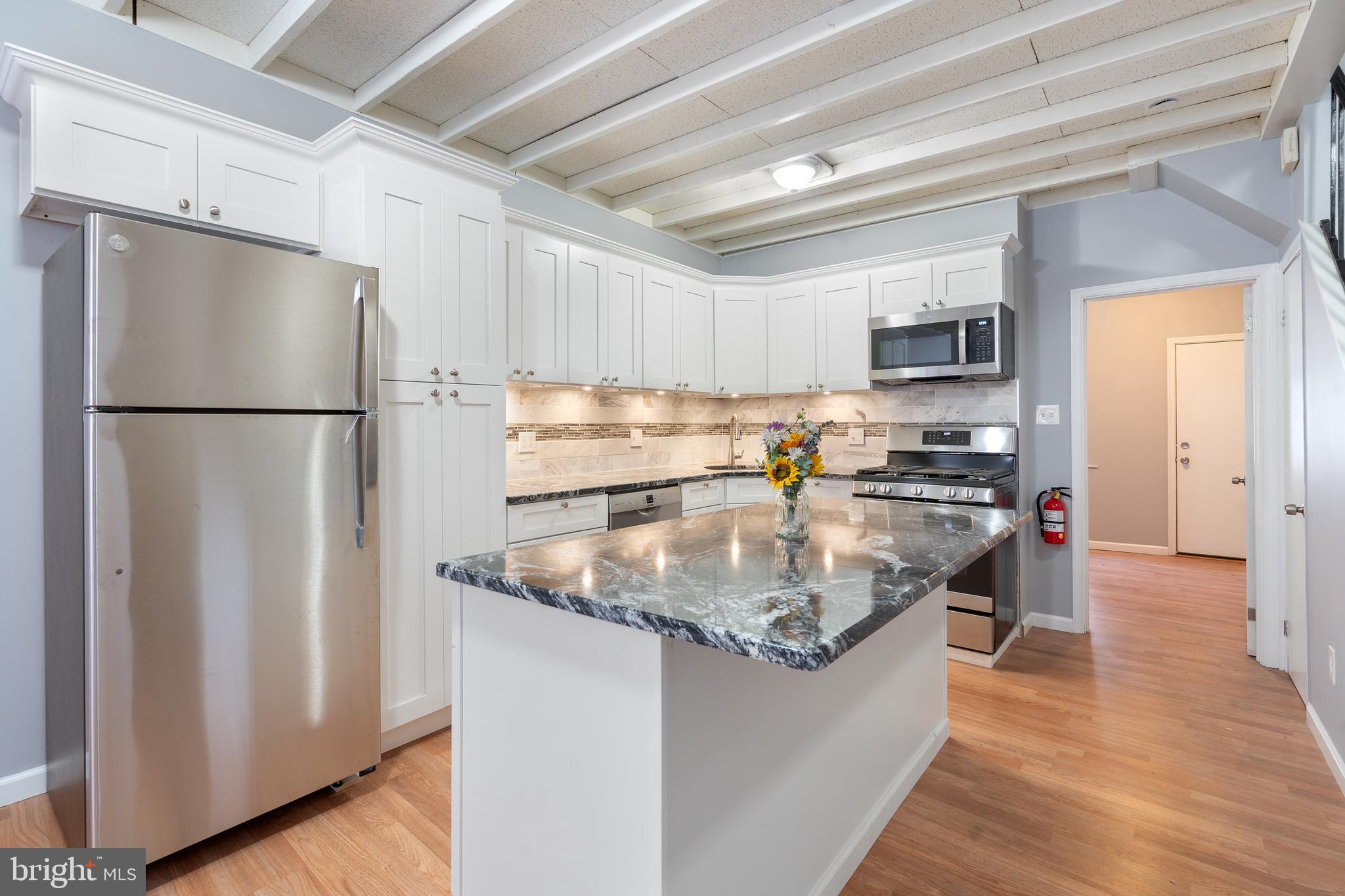 Welcome to 714 S Randolph Street, a stunningly renovated townhome offering 4 bedrooms, 2 full bathrooms, plus a den & private outdoor patio, all in the heart of Queen Village.
This home features a brand NEW kitchen, including new cabinets, NEW stainless steel appliances, NEW washer/dryer, new flooring, new light fixtures, fresh paint throughout and central air/heat.
Originally a two-unit building, this home has been transformed into a spacious single-family residence that combines modern design with timeless charm. It’s numerous closets and wide-open full basement can accommodate space for all your knick-knacks with room to spare, just incase you’re unable to resist indulging in the nearby shops of South Street.
Enter through the main entrance into a bright kitchen and dining area, leading to the first bedroom with direct access to a private back patio—perfect for relaxing or entertaining outdoors.
The second floor includes a spacious living room, the second bedroom, and the first full bathroom. On the third floor, you'll find two additional large bedrooms with fantastic east and west-facing views. The third floor also offers the second full bathroom, conveniently located in-unit laundry, and a small den—ideal for an office or cozy reading nook.
Separate, private off-street parking may be available depending on its availability at the time of request.
Located just steps from the best of Queen Village, Bella Vista, South Street, and Center City, this home offers modern amenities in a prime location. Don't miss the chance to make this beautiful property your own!