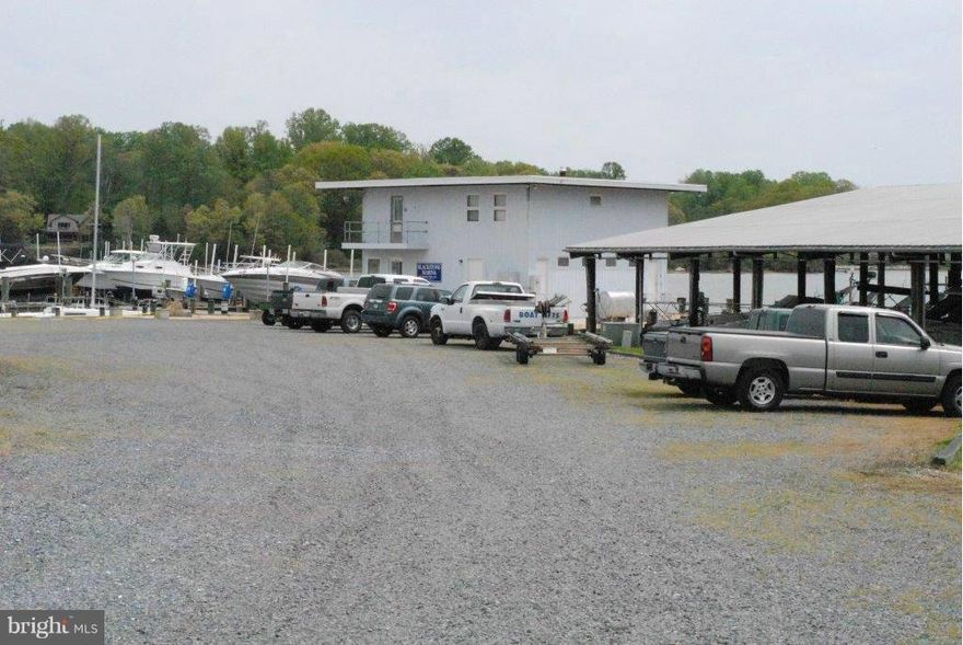 2.11 ACRES ON CUCKOLD CREEK  42 OPEN AND 16 COVERED BOAT SLIPS, OFFICE WITH AN APARTMENT AND WORKSHOPTOTAL OF FOUR (4) RESIDENTIAL UNITS CONVEY.  ONE IS LOCATED ON A SEPARATE PARCEL THAT COULD BE SOLD IMMEDIATELY AND THE REMAINING THREE COULD POSSIBLY BE SUB-DIVIDED  MARINA DESIGNATED AS A "CLEAN MARINA" BY DNR                           APPRAISAL AND FINANCIALS AVAILABLE TO APPROVED CLIENTS ONLY