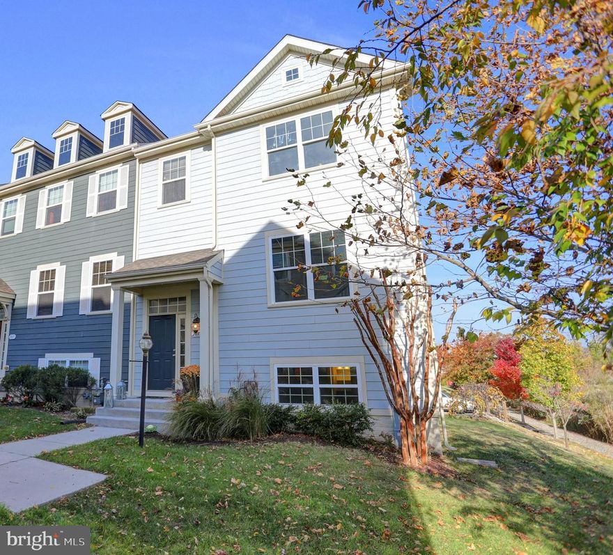 Rarely available immaculate end of group townhome in the peaceful and desirable Village of Bear Creek community. Located on one of the few premium lots in the community featuring exceptional views from nearly every room overlooking Bear Creek and Sparrows Point golf course.  Natural light abounds the 4 levels with 3 bedrooms and 2.5 baths , a basement office (could be converted into a bedroom) with it s own .5 bath and a top floor loft area with a wet bar/mini fridge and access to a large rooftop deck with breathtaking panoramic views. Some of this home's endless features include: New carpeting/vinyl flooring, Fresh paint throughout, Living room gas fireplace with a 65" Sony Bravia TV above which is included, Hardwood flooring, 9' ceilings, Custom moldings, Built-in speaker system in the living room, kitchen & rooftop deck, Gourmet kitchen with granite counter tops, Maytag washer & dryer less than 1 year old, Composite main level deck w/double sliding glass doors and a welcoming covered front porch.  Off street parking is provided by a driveway and 2 car rear entry built-in garage. This community features private gated water access with a deep water pier, kayak & paddle board storage/launch and boat slips which are available for rent. Excellent opportunity to live in this convenient and beautiful water oriented community at a fraction of waterfront cost!