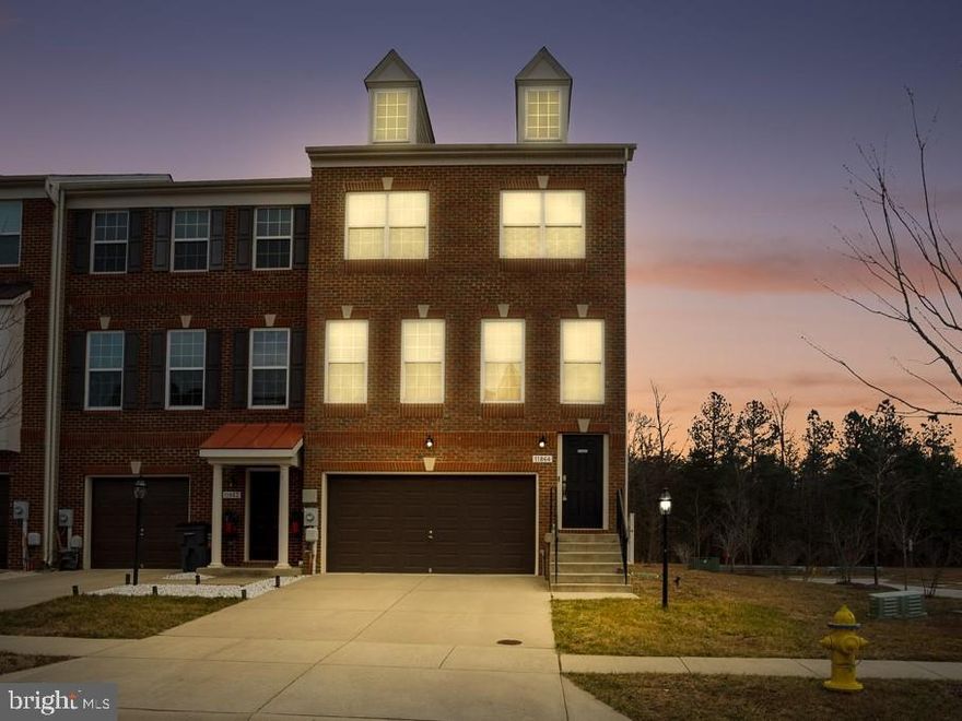 Welcome home to 11864 Sunset Ridge Pl!  This beautiful, brick, end unit townhome has it ALL!  Featuring 3 levels with a large open floor plan, 9-foot ceilings, hardwood floors through-out the kitchen with upgraded cabinets, granite counter tops, stainless steel appliances and gas range.  Just off the kitchen, is a new trex composite deck - perfect for family dinners, entertaining or relaxing after a long day at the office.  The upper level has a spacious master bedroom with vaulted ceilings, walk in closet and en-suite with dual vanity, soaking tub and separate shower.   Two additional bedrooms share a full bathroom with walk in shower.  Enjoy additional living space in the fully finished basement with large family room and bathroom that can be entered through the 2 car-garage or walk-out rear entrance.  The back yard has lots of privacy with a 6 ft. vinyl fence and is lined with mature trees - No plans to build behind home.  The stairlift will be removed but can stay upon request.  This home is within walking distance to schools and the Southern Maryland Blue Crab's stadium and is  located close to commuter routes, restaurants, and shopping.  Do not miss your opportunity to be the proud new owner!