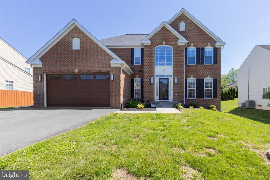 Great curb appeal with beautiful garage door and front entrance door as well as nicely landscaped. As soon as you enter, you realize this is a well maintained home. Nice open stairway and two-story foyer to the second floor. First floor offers living room as well as a family room off the kitchen. Formal dining but breakfast room also and, counter seating in a beautifully laid out kitchen. Granite counters, gas stove, built in microwave, oversized refrigerator and matching dishwasher. Breakfast room has lots of windows and wonderful sunlight coming in.  Dark laminate floor flows nicely and easy clean. Only steps away to a large paved patio area and wrought iron fenced backyard. Yard backs to one of the common areas, allowing nice privacy in the rear as well as additional play yard! All four of the upstairs bedrooms are carpeted. Primary bedroom is extra large with an ensuite bath with separate tub and shower.  The primary bedroom closet has custom built- in shelving. Another bath off the other 3 bedrooms rounds out the second floor. Downstairs finds a large finished area which could be playroom, office, hobby or even an extra bedroom. A half bath services that area and an outside walkup entrance.  Lots of updated lighting and ceiling fans. New roof in 2025, new HW heater, 8 yr. old heat pump. Guardian alarm system and Ring cameras.