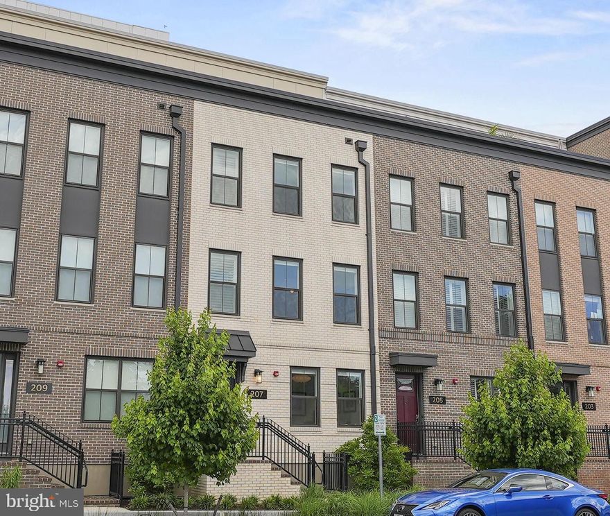 This one is special! Super stylish townhome at the Venue with a rooftop outdoor oasis complete with Potomac River views and an outdoor kitchen. It is the ideal spot to unwind after a long day, enjoy a morning cup of coffee and watch the 4th of July and New Year's Eve fireworks. Adjacent to the rooftop terrace is a generous living space that is perfect for effortless indoor outdoor entertaining. Upon entry you will be greeted by custom floor to ceiling glass doors leading to a home office/den with loads of light and a Herman Miller Nelson light fixture. On the second level you will be delighted by the gorgeous chef's kitchen with upgraded Bosch appliances, counter-depth paneled refrigerator and dishwasher, quartz countertops and matching quartz backsplash, beverage center, designer pendants by Pablo Designs and Moooi "Random" dining light fixture. The kitchen is open to the family room making for the perfect flow for day to day living and entertaining guests.
Convenience abounds with a Savant Smart Home system with automation throughout. No detail was overlooked by the current owner to take this home from builder nice to Custom WOW. Just steps to the bike path along the Potomac, shops, restaurants, Harris Teeter and all that Old Town has to offer. Minutes to DC.

PLEASE SEE BELOW FOR A COMPLETE LIST OF UPGRADES AND DON'T MISS 3D TOUR

Technology/Automation
Savant smart home system controlling Lutron lighting, Lutron roller shades, Samsung Frame TV, and music (surround sound speakers in Living Room, additional speakers in Kitchen and Primary Bedroom)
Ring doorbell and security cameras on front and back of home
Hardwired WiFi repeaters to provide strong signal throughout home
Google Nest smart thermostats (2 zones)
UV air purification systems installed on both AC/heating units

Rooftop/Loft
Outdoor kitchen with oversized gas grill, sink, refrigerator, and granite countertop
SYNLawn artificial grass on rooftop deck
Modern Fan Company "Ball" ceiling fan in main loft area
Pre-wired for TV

Kitchen/Dining
Upgraded Bosch Kitchen appliances with counter-depth paneled refrigerator and dishwasher
Upgraded quartz Kitchen countertops and matching quartz backsplash
Designer Kitchen pendants (Pablo Designs) and Dining Room light fixture (Moooi "Random")
Beverage refrigerator in Kitchen
Lutron power roller shades in Dining Room included in home automation
Lutron lighting in Kitchen and Dining Room included in home automation

Primary Bathroom
Upgraded marble tile shower and floor
Upgraded marble tile 3-sided wet wall above/around double vanity

Secondary Bathrooms
Upgraded tile in secondary bathrooms
Upgraded shower option in top floor (guest) bath

Primary Bedroom
Savant home automation-controlled speakers in Primary Bedroom
Savant home automation-controlled Lutron blackout roller shades and Lutron lighting in Primary Bedroom
Elfa closets
Modern Fan Company "Ball" ceiling fan in Primary Bedroom

Secondary Bedrooms
Savant home automation-controlled Lutron blackout roller shades Bedrooms 2&3
Elfa closets
Office
Floor-to-ceiling sliding glass doors separating office from foyer
Herman Miller Nelson office light fixture
Lutron power roller shades

Storage
Elfa closets throughout home
Suspended garage storage

Misc.
Upgraded matte black hardware throughout home