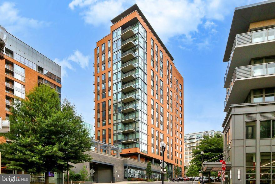 Luxury 1-Bedroom + Den Condo with 1.5 Baths in the Heart of Arlington

Experience the ultimate in modern living at 2000 Clarendon—a rare corner unit featuring soaring 11-ft ceilings, abundant natural light from numerous windows, breathtaking views of the Rosslyn skyline and nearby parks, and high-end designer finishes throughout. This sophisticated space offers a spacious bedroom and a versatile den, perfect for a home office or guest suite.

The chef’s kitchen is a true showstopper, boasting custom 42” shaker cabinets, quartz countertops, a stunning oversized island, and premium stainless steel appliances—ideal for both everyday living and entertaining. Step onto your private balcony to take in the vibrant Clarendon skyline, perfect for morning coffee or evening relaxation. Inside, a custom walk-in closet provides maximum storage, while an in-unit washer and dryer add everyday convenience. Additional storage is included, and an assigned garage parking space ensures effortless city living.

Beyond the unit, residents enjoy resort-style amenities, including a pool, fitness center, and clubhouse. The condo fee covers gas, water, trash, sewer, and more, offering peace of mind and exceptional value. The location is unbeatable—just two blocks from the Courthouse Metro (Silver/Orange lines) and steps from Arlington’s best dining, shopping, and entertainment.

With its rare combination of luxury, location, and lifestyle, this condo is a must-see. Schedule a private tour today before it’s gone!