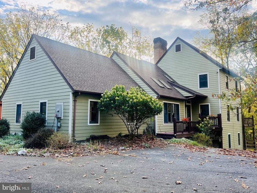 Are you looking for a homestead that allows you to have chickens, a horse, a veggie garden, a workshop,…maybe build a greenhouse or guest cottage on the lot? A meandering driveway leads to a unique home with ample space including a basement with separate entrance and kitchenette bathroom that could be rented out to produce supplemental income. Walking pathways through the wooded areas allow for extra exploration. The house feels like a perfect place to raise a family or a second home/get away from the hustle and bustle of city life. 

This 4 bdrm,  3 1/2 bath,  2 story home has double car garage with a ton of extra storage room, a new roof, Hardie board exterior. The vaulted ceilings include skylights and recessed lighting. 

An extra perk is a detached workshop/art studio/equip storage barn w/ electric already in place and a wood stove for heat. 

Close to historic Shepherdstown in a peaceful rural neighborhood, it offers the best of both worlds. 

If you are looking for a house to entertain…this home is the one! The large ‘house-wide’ back deck is great for entertaining and relaxing, w/ several entrances to the home’s interior.  The main level offers a wide two story high open foyer entrance, spacious living room, dining room and fabulous separate family room. A cozy wood fireplace, floor to ceiling brick wall, wide raised hearth and  natural wood mantel are a plus.  And even more space the home has the ‘’great room’ with  vaulted ceiling is big enough to house two chamber grand pianos!

This is a must see home with so much potential just waiting for its new owner.